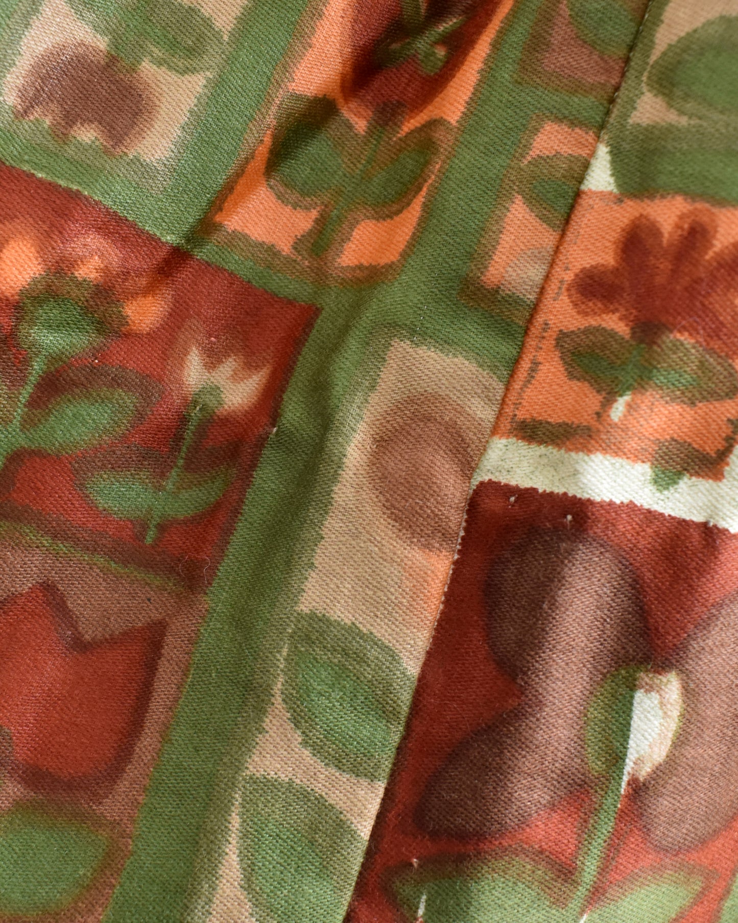 a spot on the dress that might be color bleed or part of the print