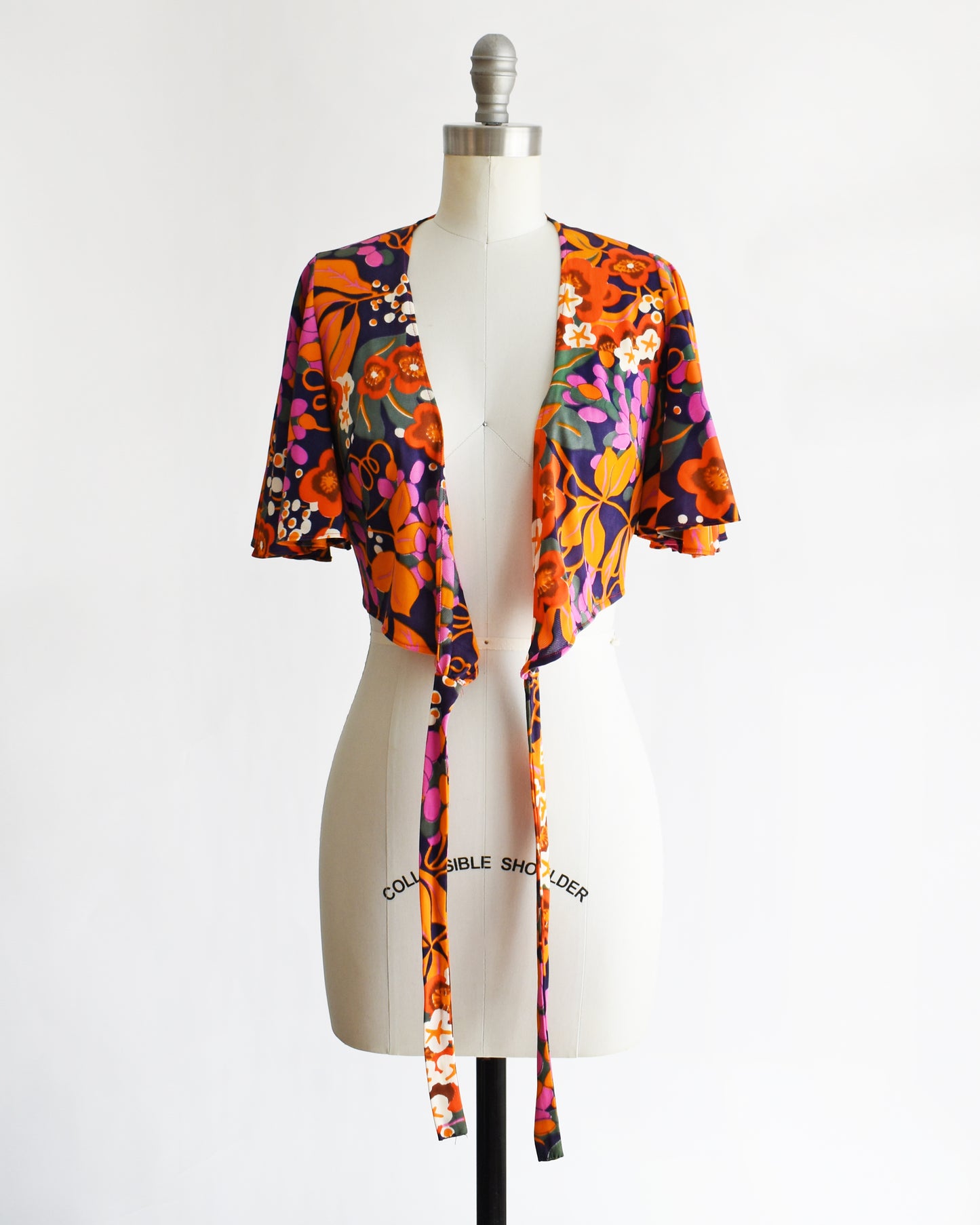 a vintage 70s floral wrap blouse that's untied