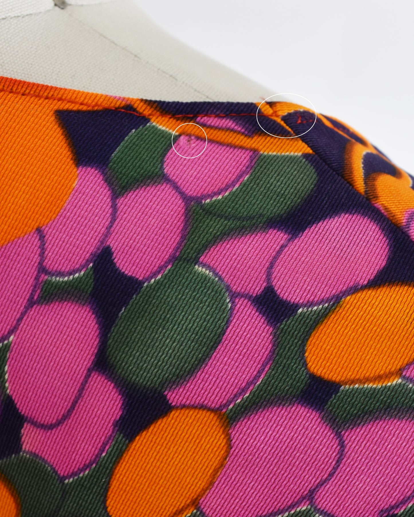 close up of small flaws on the back of the right shoulder