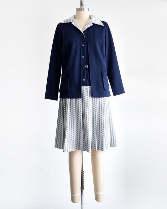 a vintage 1970s mod two piece set which features a navy blue jacket and matching dress