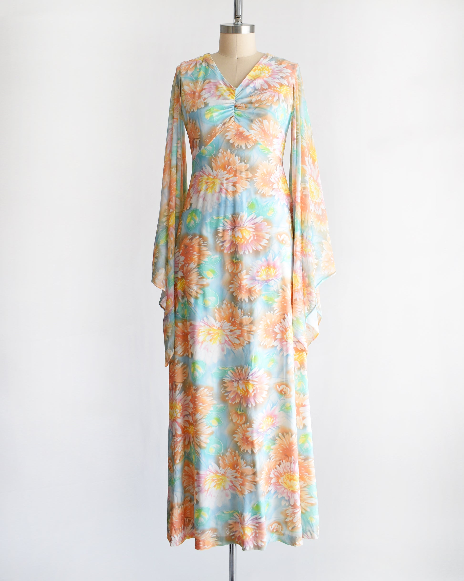 a vintage 1970s floral maxi dress with long angel sleeves
