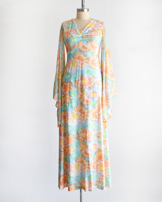 a vintage 1970s floral maxi dress with long angel sleeves