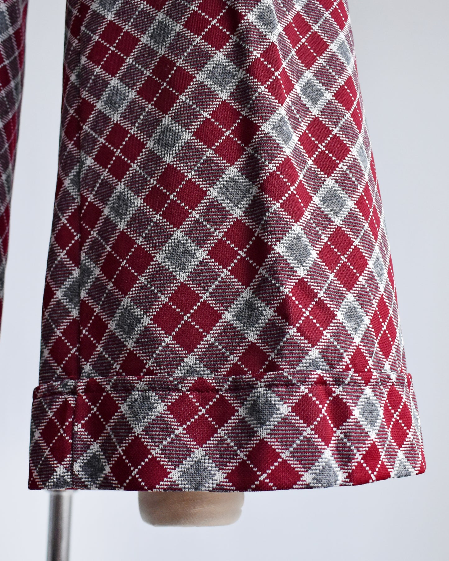 close up of the bell bottom pant cuffs