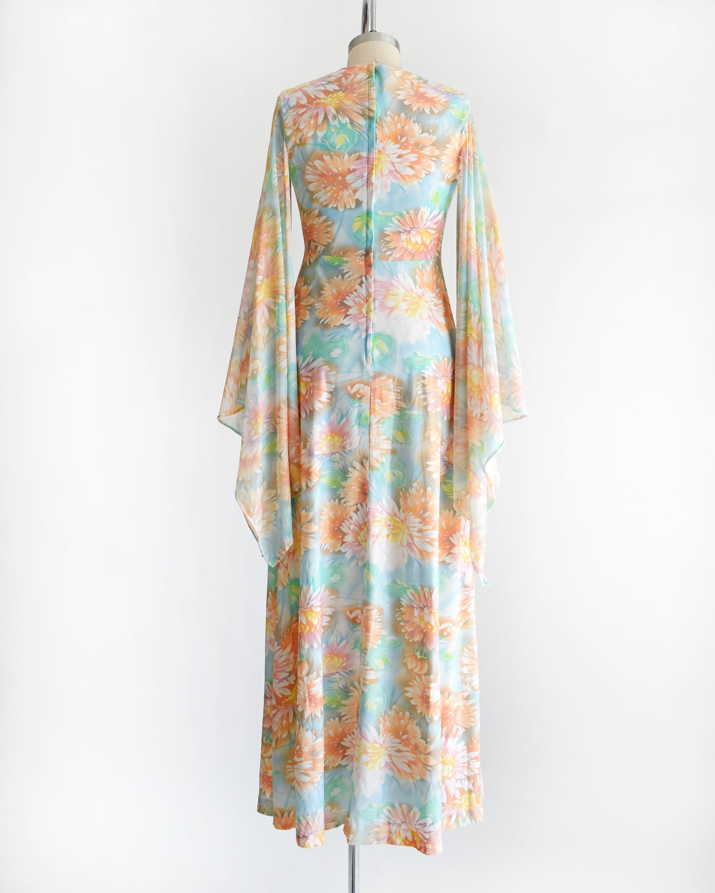 back view of a vintage 1970s floral maxi dress with long angel sleeves