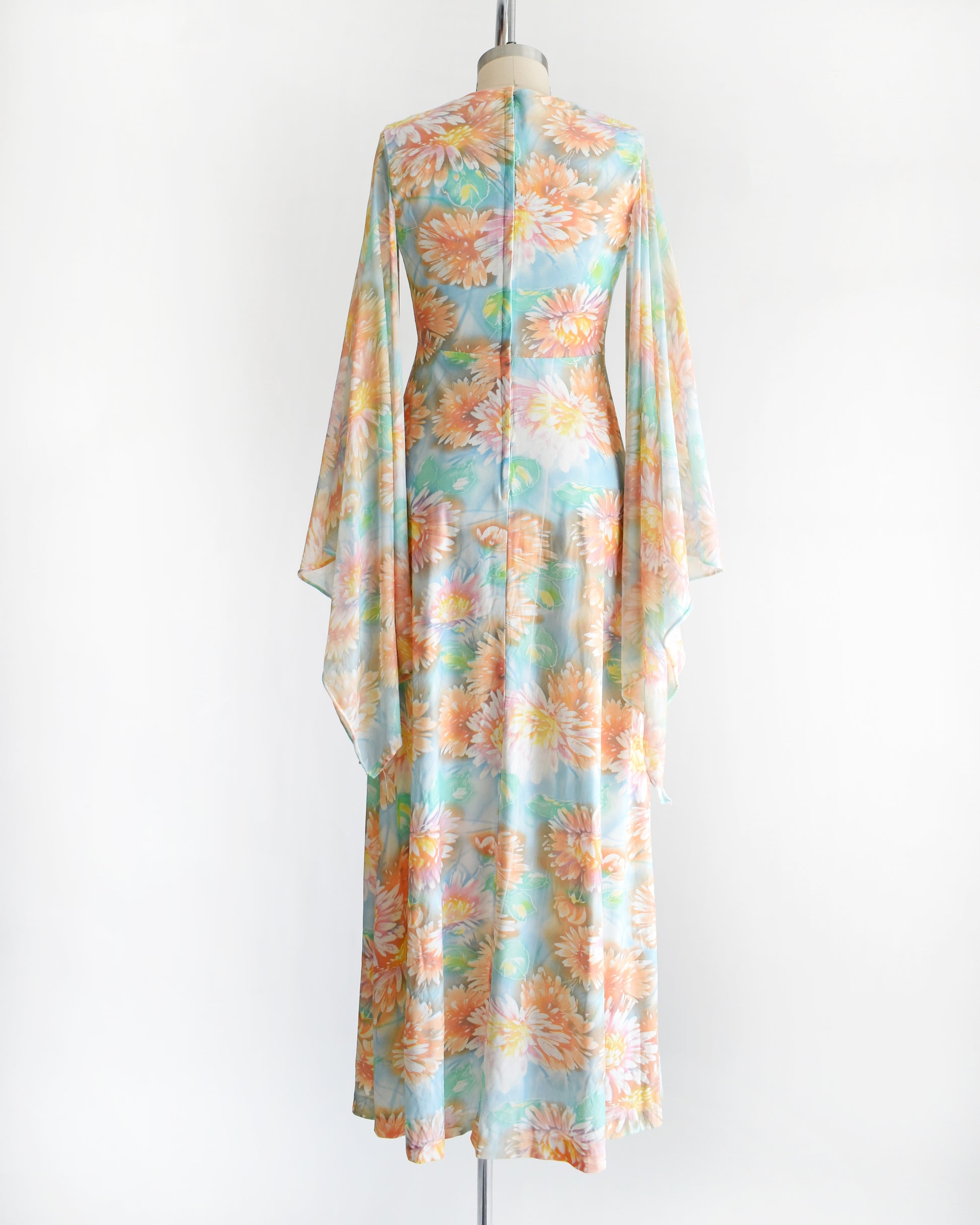 back view of a vintage 1970s floral maxi dress with long angel sleeves