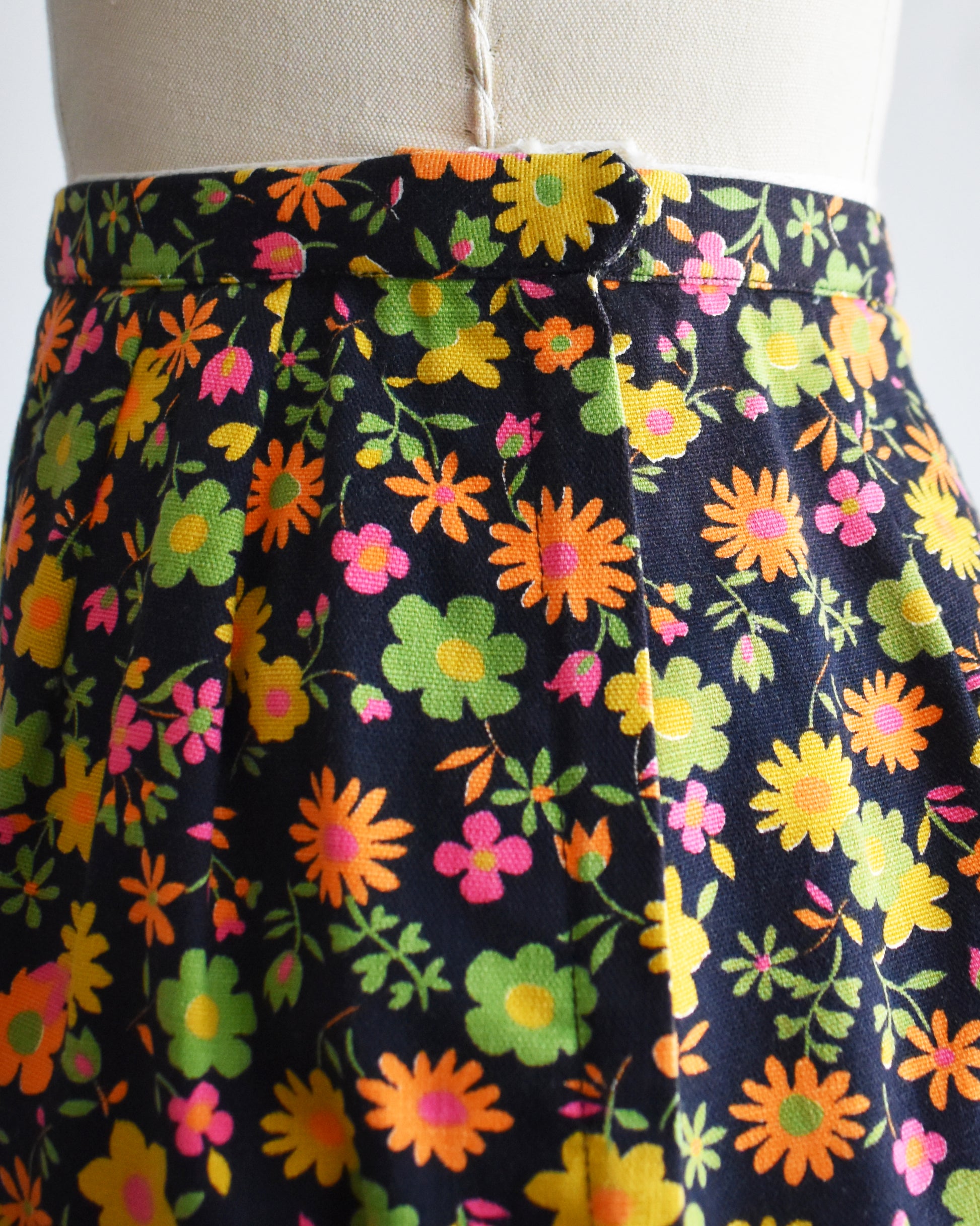 close up of the zipper closure on the black floral skirt