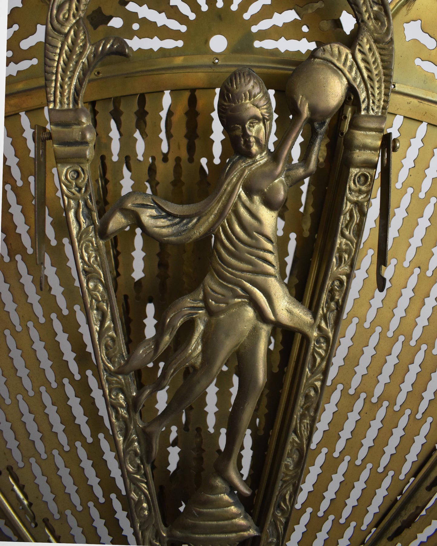 Close up of the ornate detail and person on the fan