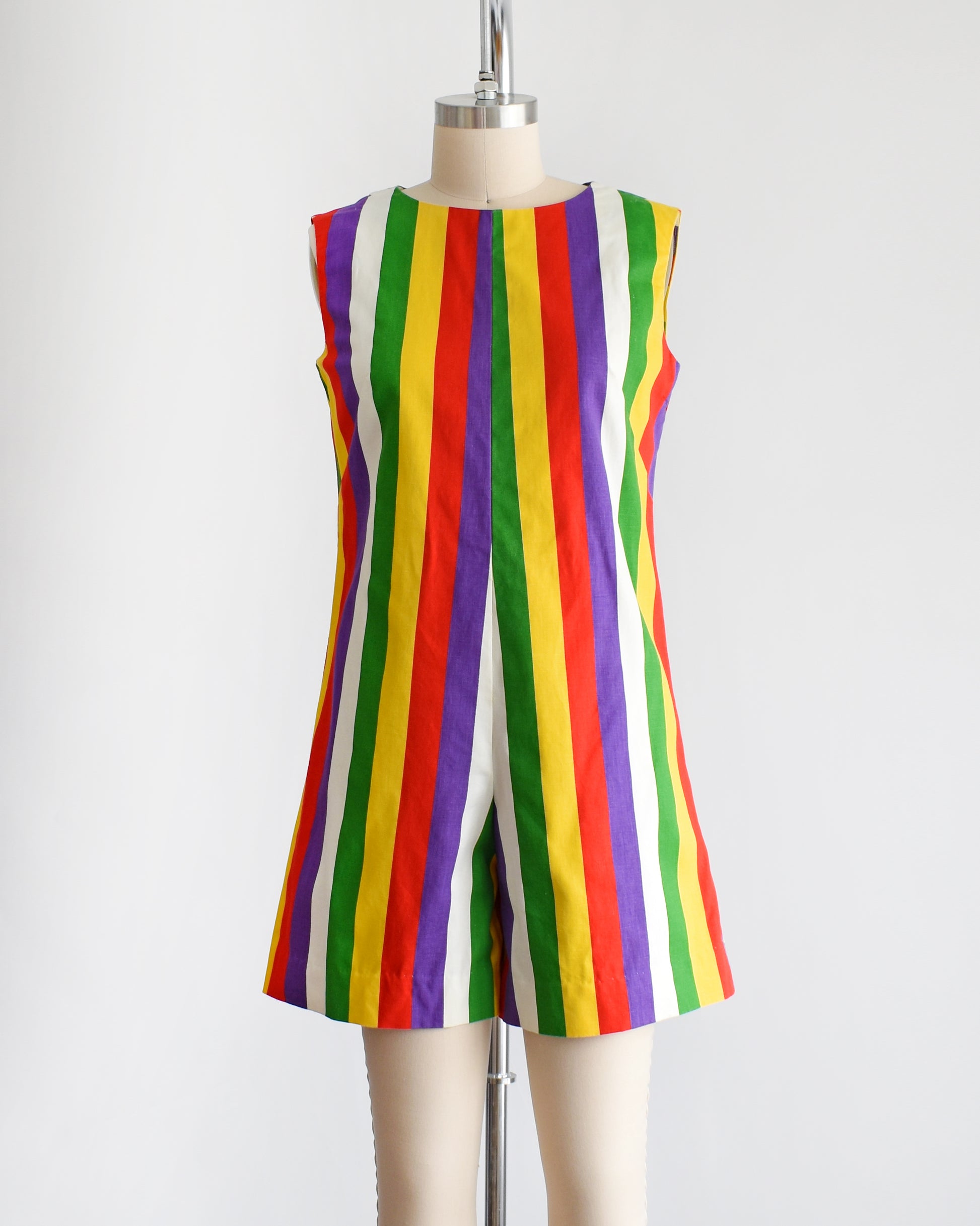 a vintage 1960s rainbow striped romper on a dress form.