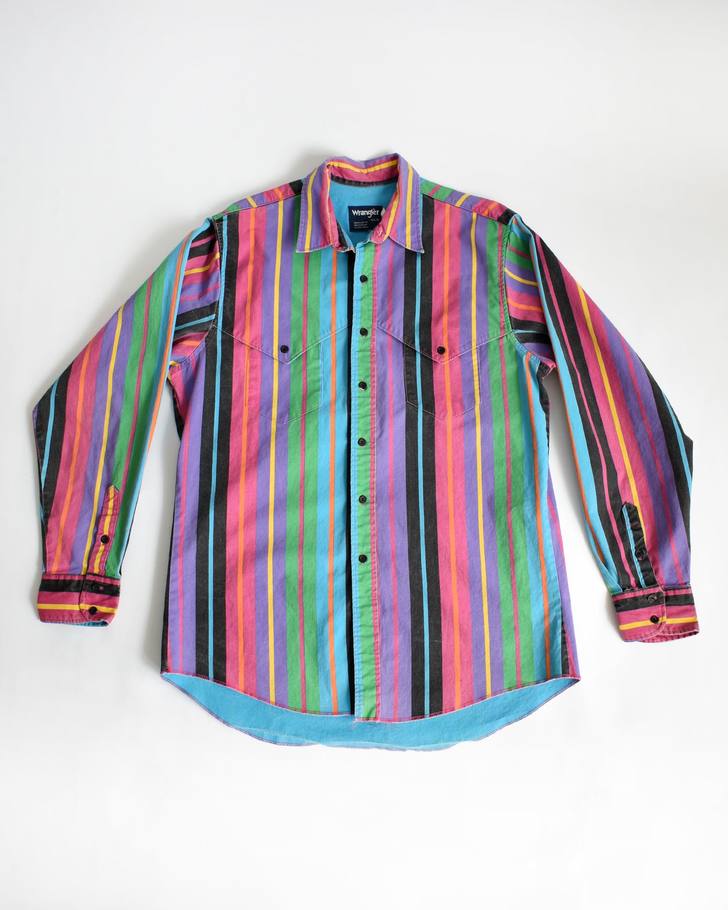 a vintage 90s Wrangler Brushpopper multicolored striped shirt on a white background