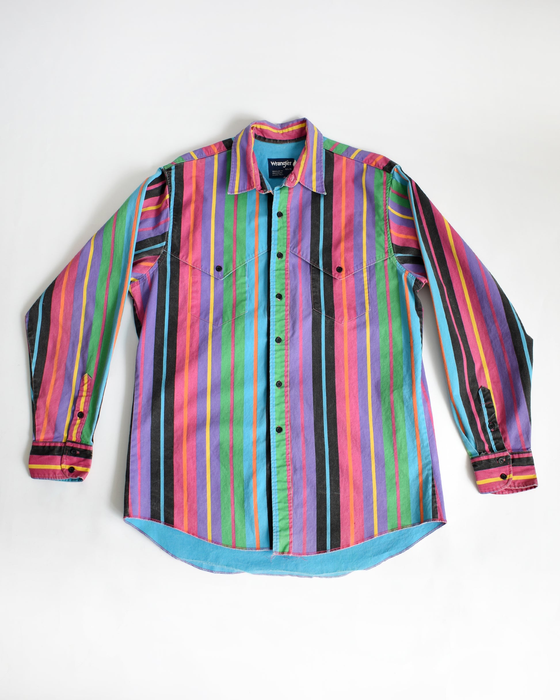 a vintage 90s Wrangler Brushpopper multicolored striped shirt on a white background