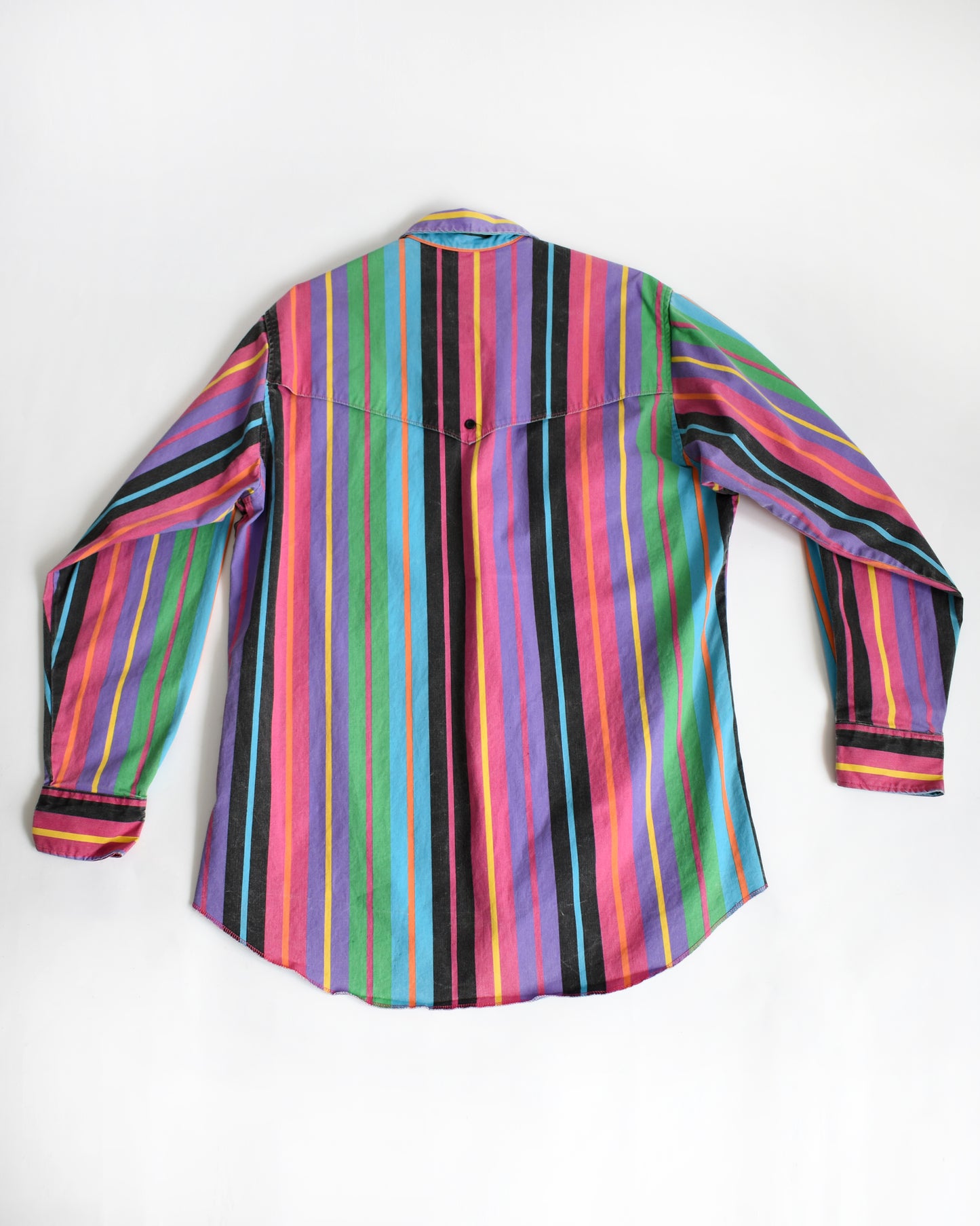 the back of a vintage 90s Wrangler Brushpopper multicolored striped shirt on a white background