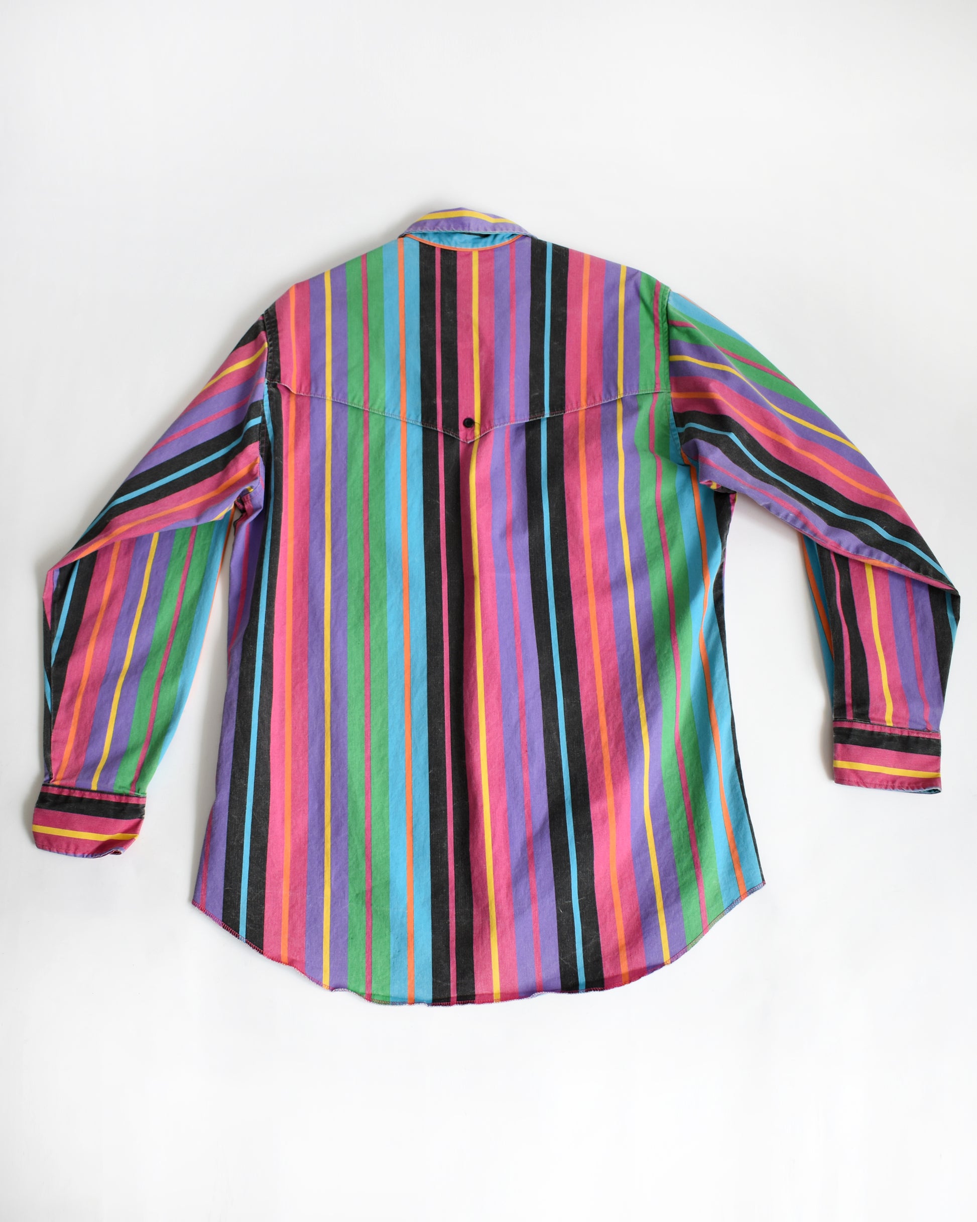 the back of a vintage 90s Wrangler Brushpopper multicolored striped shirt on a white background