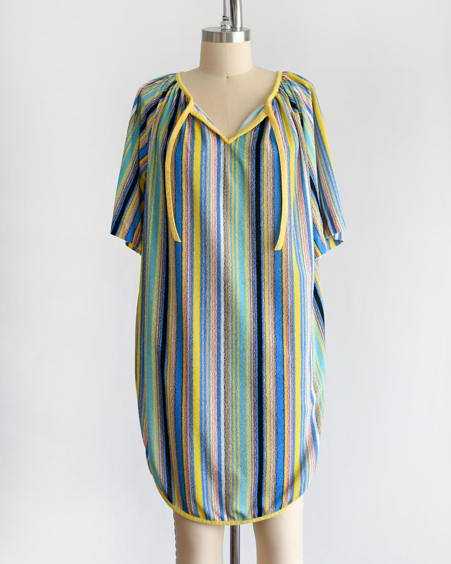 a vintage 1970s striped terry cloth cover-up dress. the neckline is untied