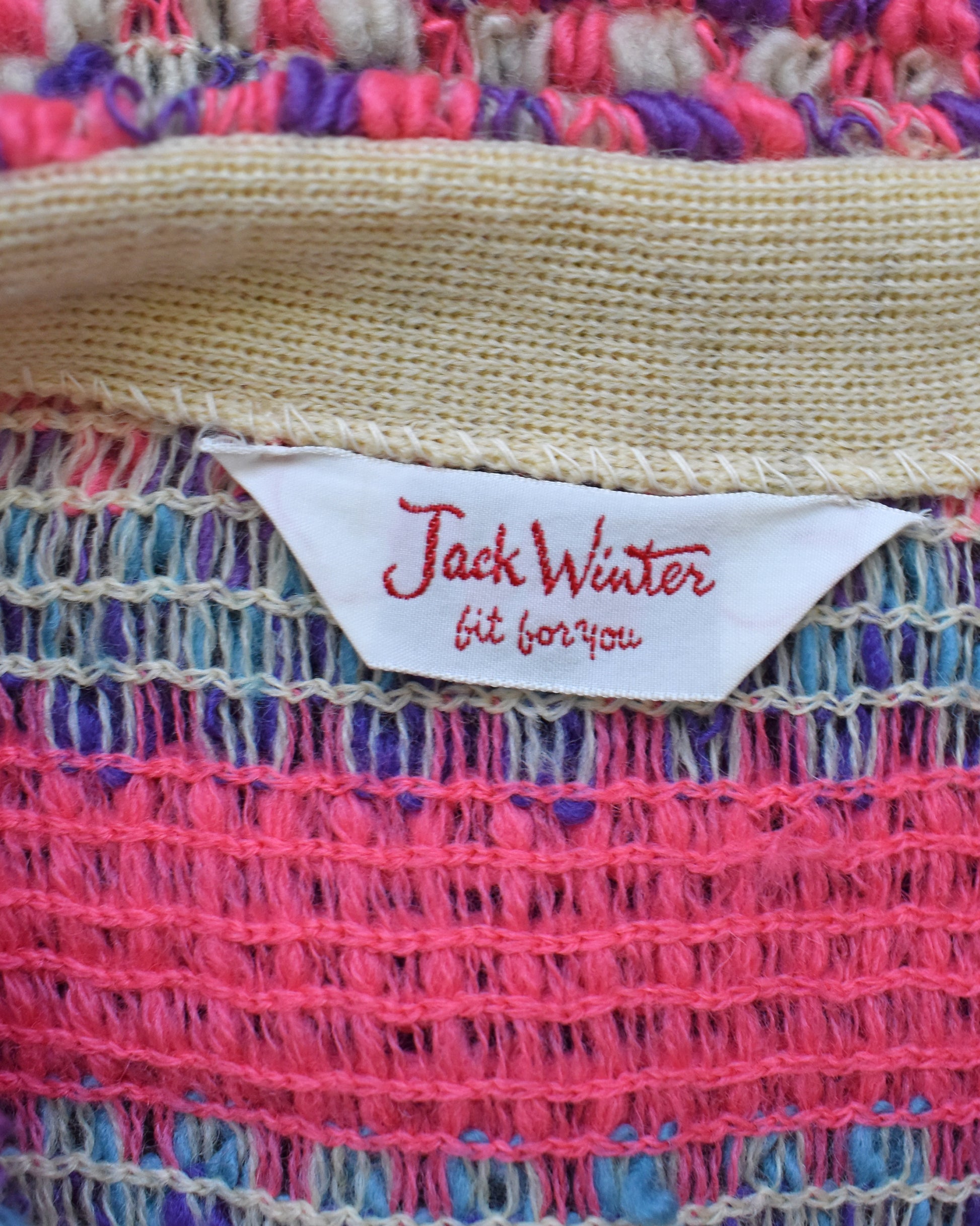Close-up of a colorful woven fabric with a 'Jack Winter' label.