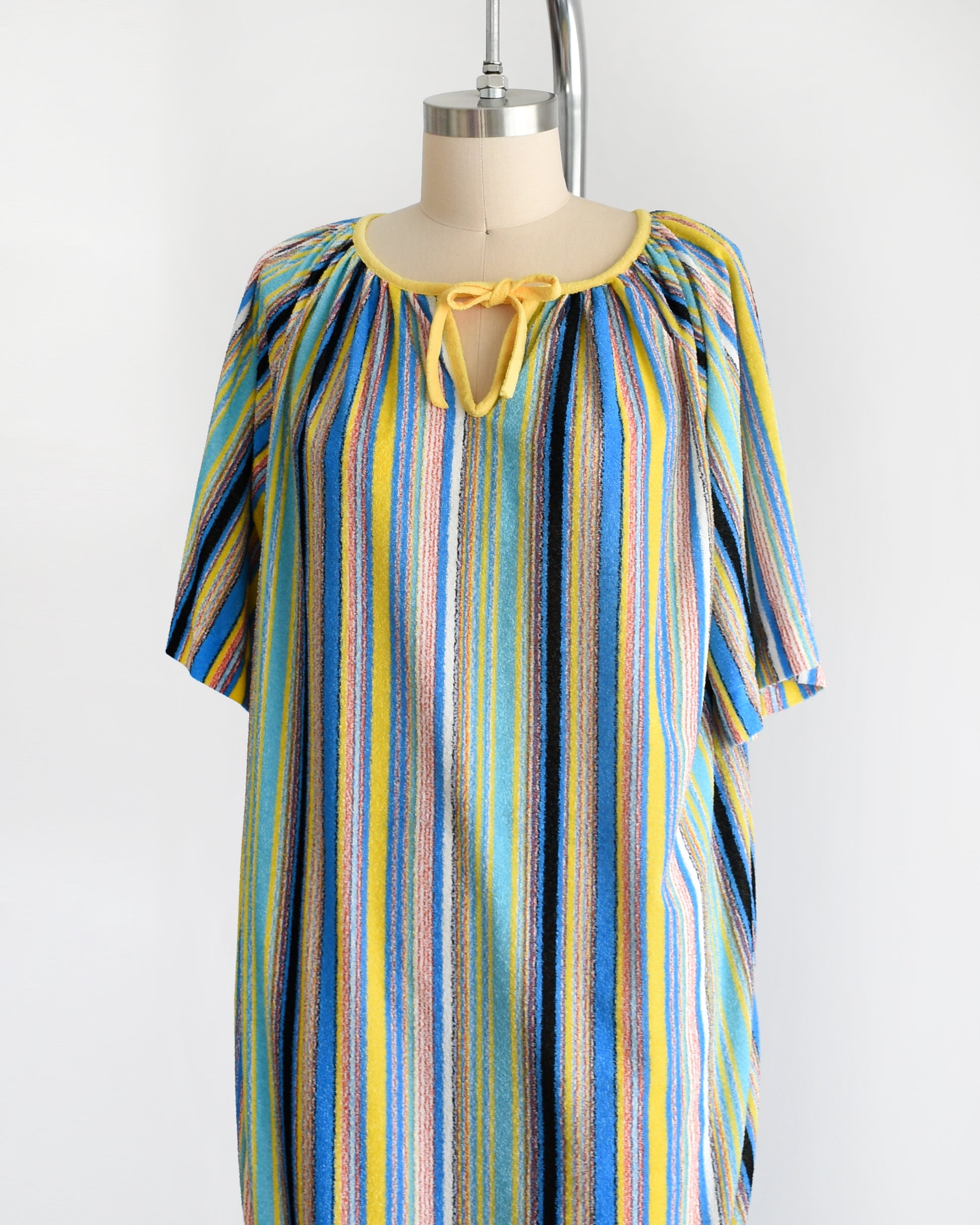 side front view of a vintage 1970s striped terry cloth cover-up dress