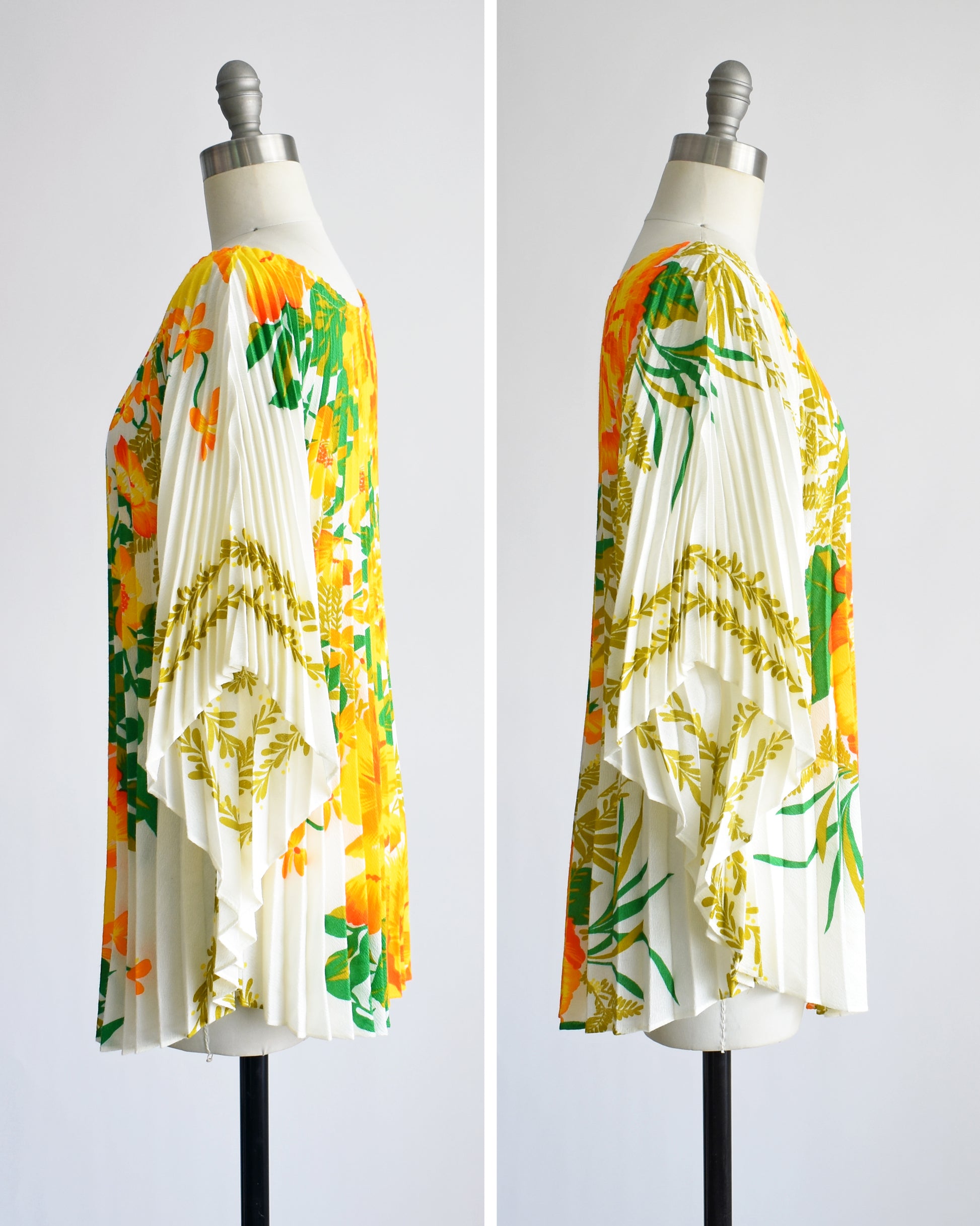 side by side front view of a vintage 1970s floral kaftan blouse on a dress form against a white background