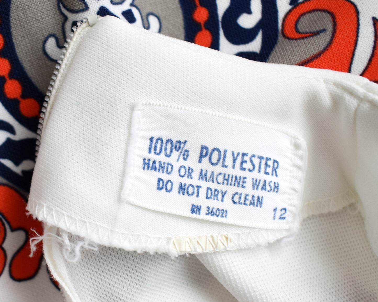 close up of the tag which says 100% polyester and care instructions