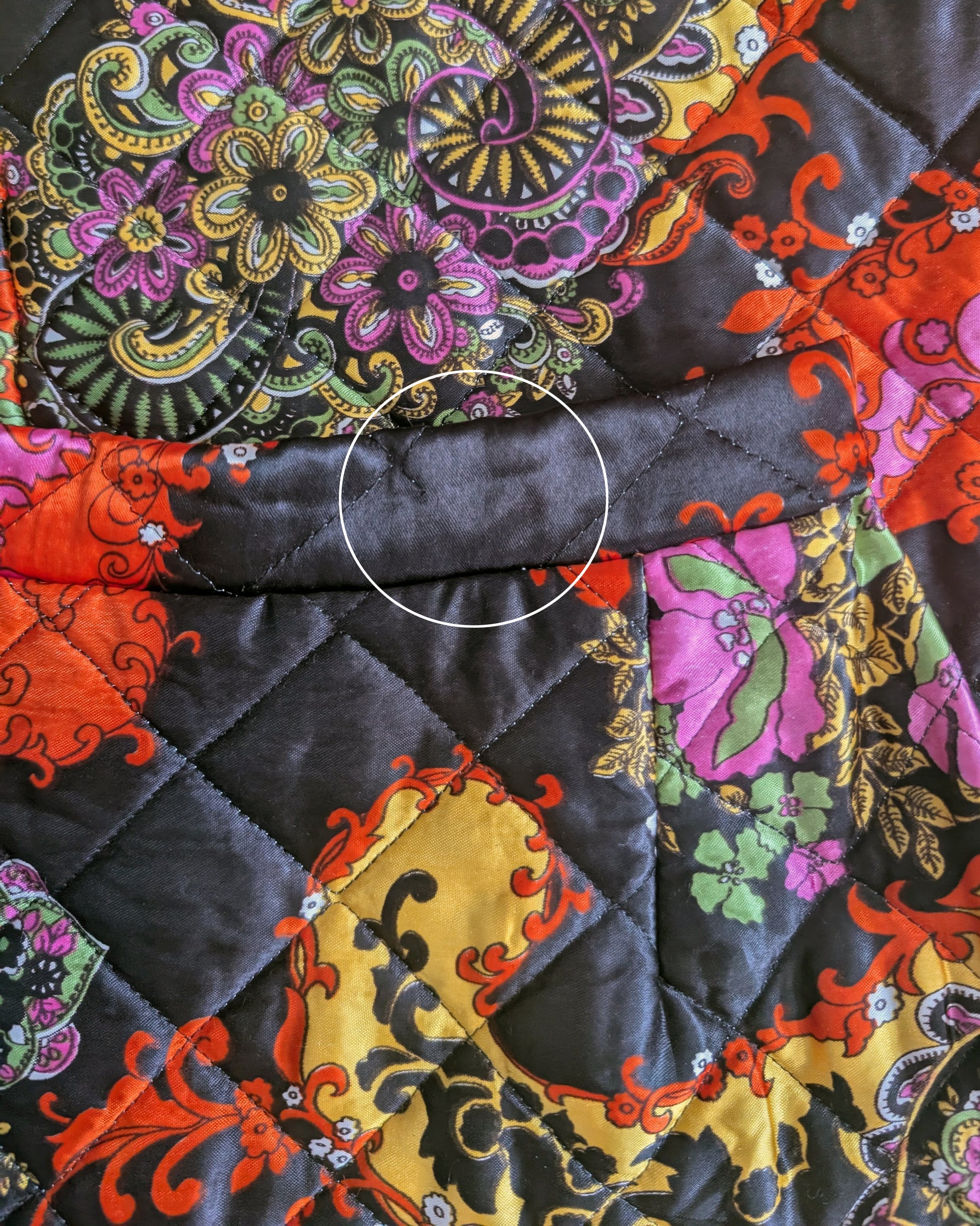 close up of the small break in the stitching on the waist