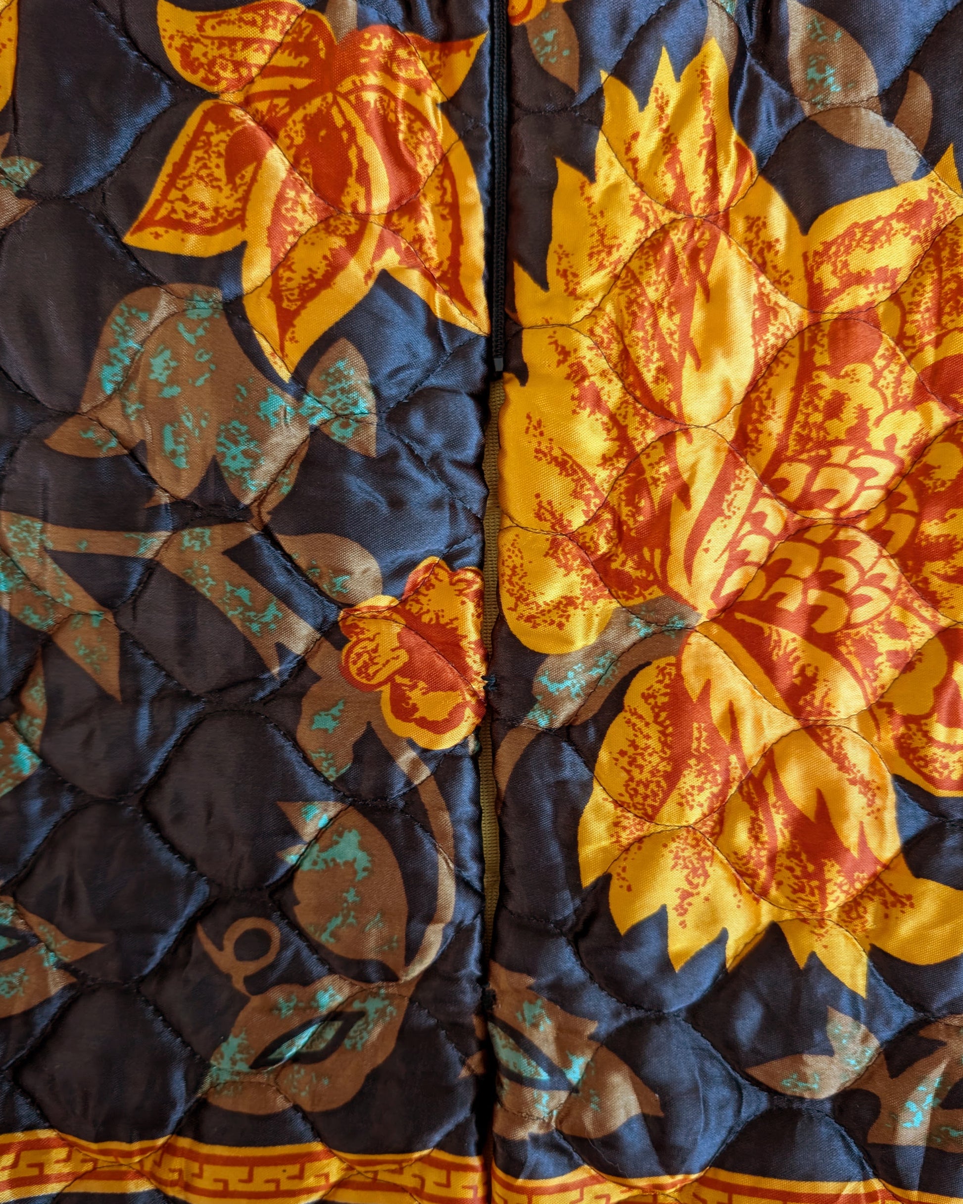close up of the back slit that is sewn together in two spots under the zipper
