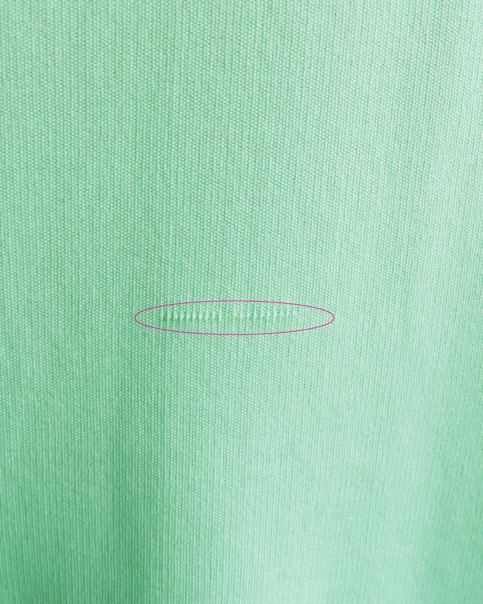 close up of a small pull on the front of the dress