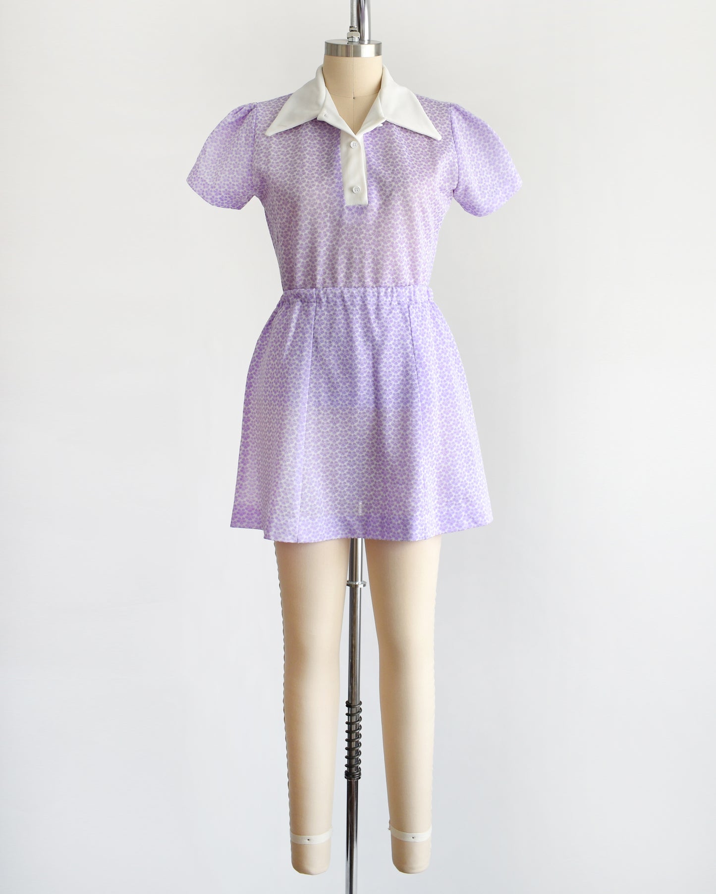 a vintage 1970s mod floral purple blouse and skirt set