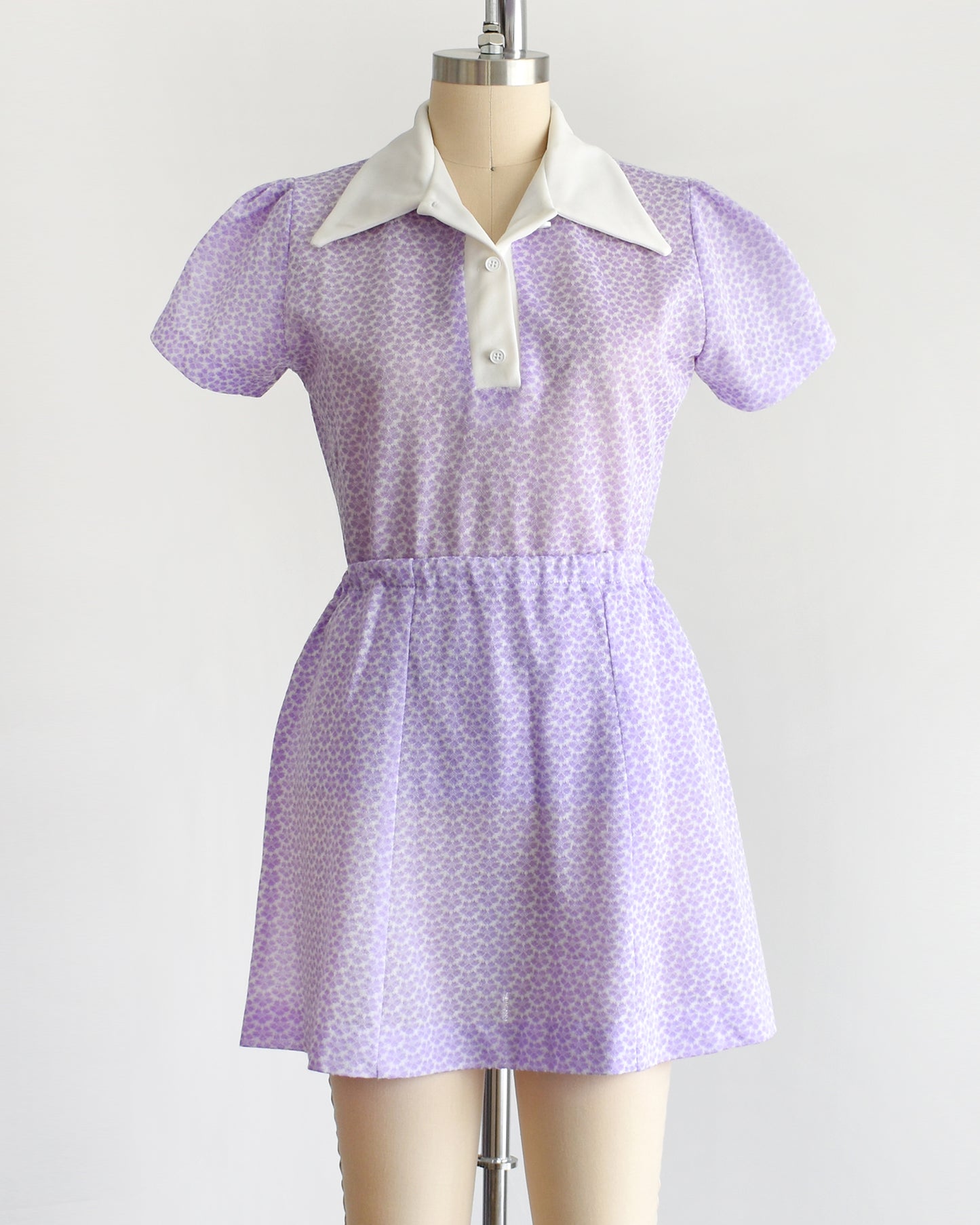 a vintage 1970s mod floral purple blouse and skirt set