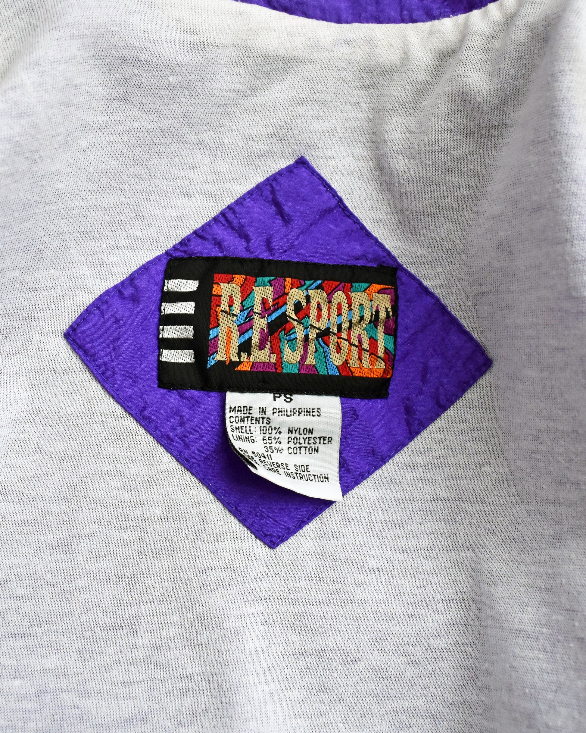 close up of the tag which says R.E. Sport