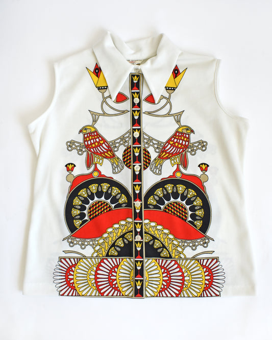 a vintage 1970s white sleeveless top with a colorful abstract bird design on a white background


