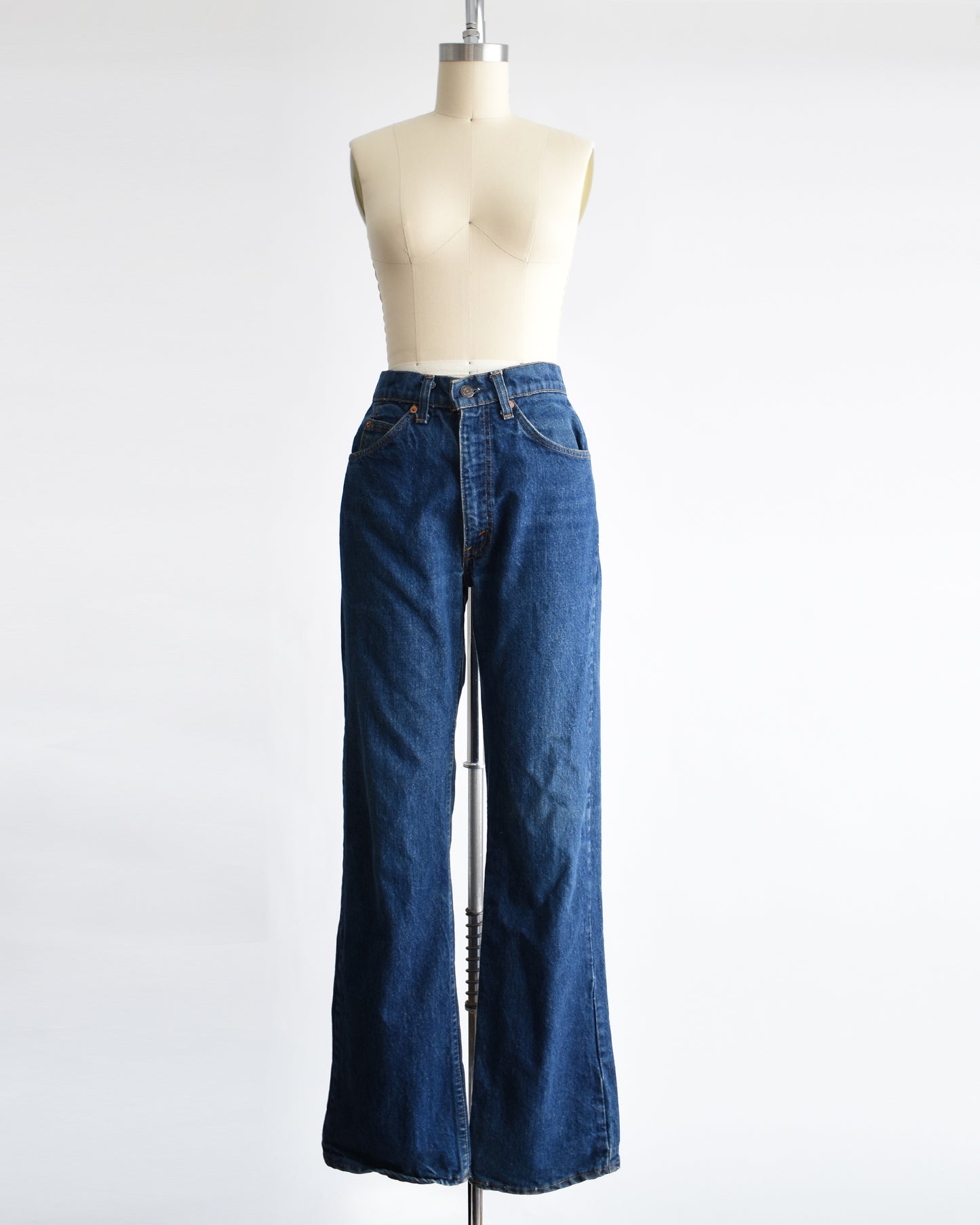 vintage 1980s orange tab book cut 517 Levi's on a mannequin on a dress form