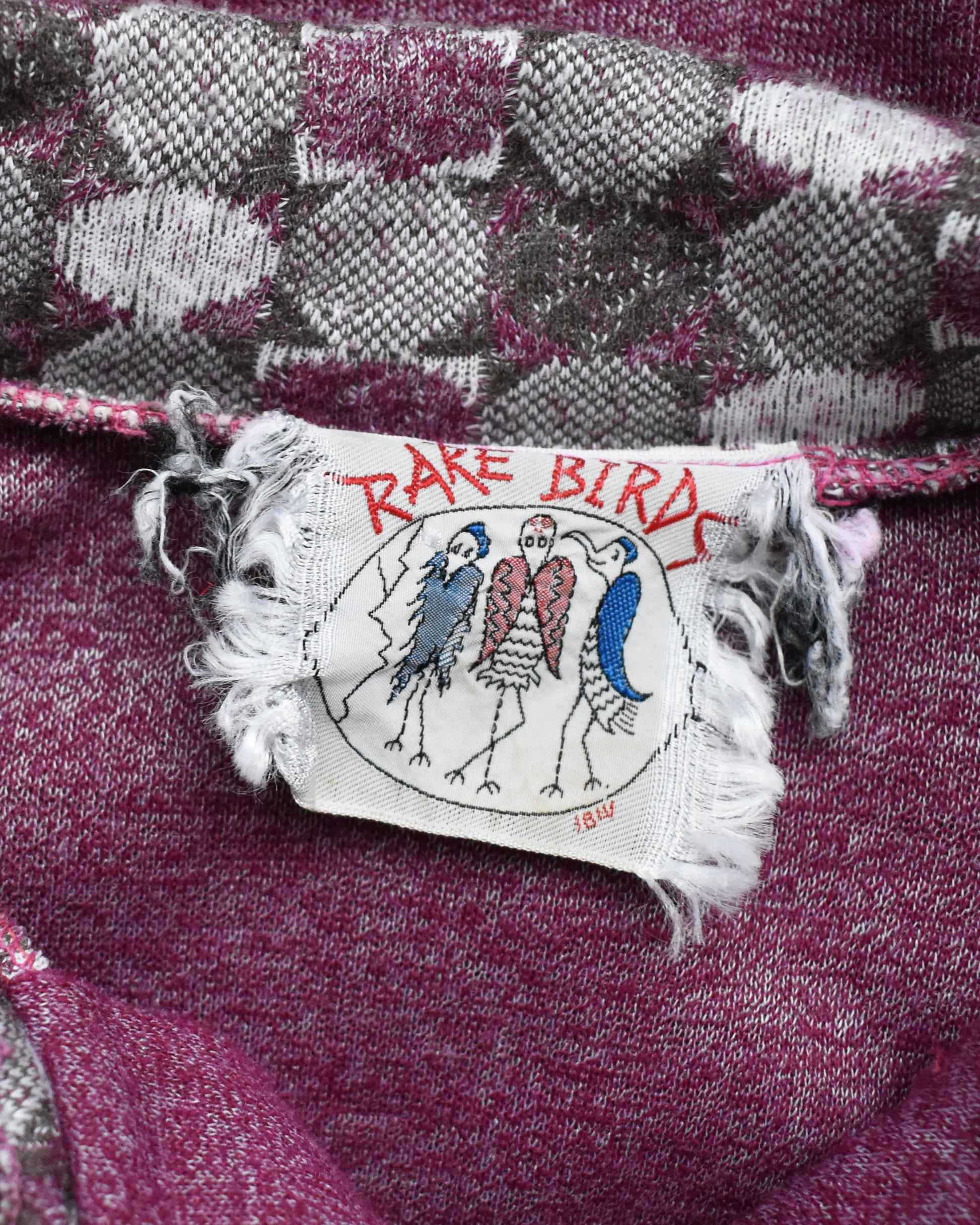 close up of the tag which says "Rare Birds"