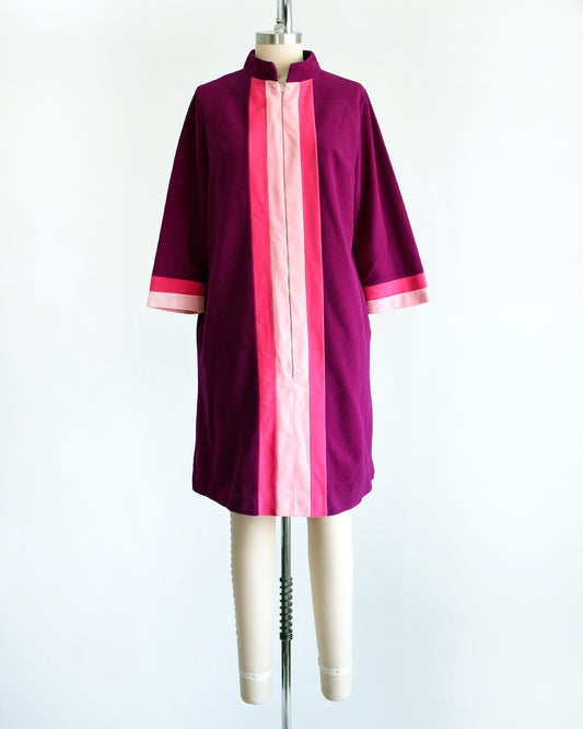 a vintage 1970s deep magenta and pink Vanity Fair robe on a mannequin against a white background