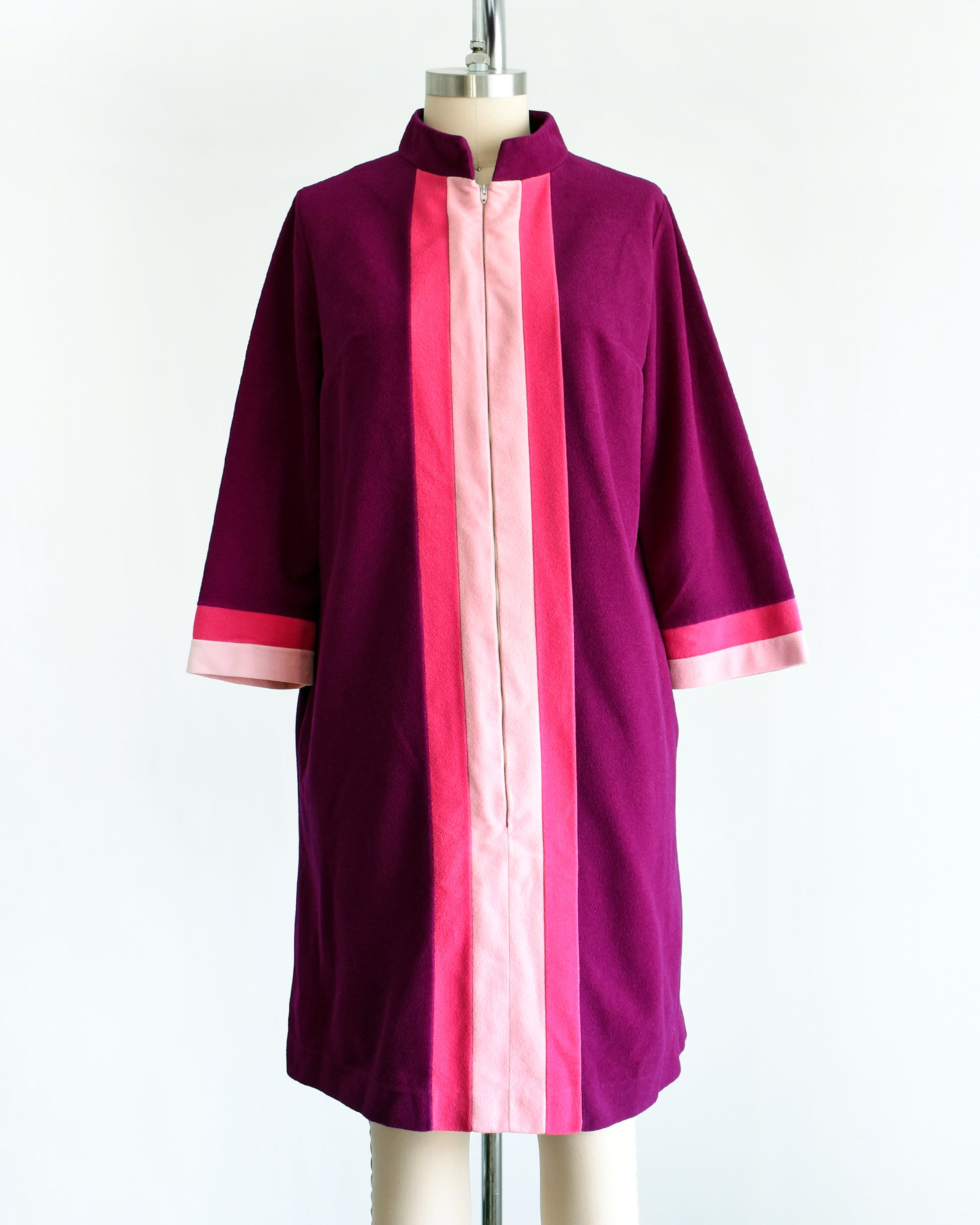 a vintage 1970s deep magenta and pink Vanity Fair robe on a mannequin against a white background