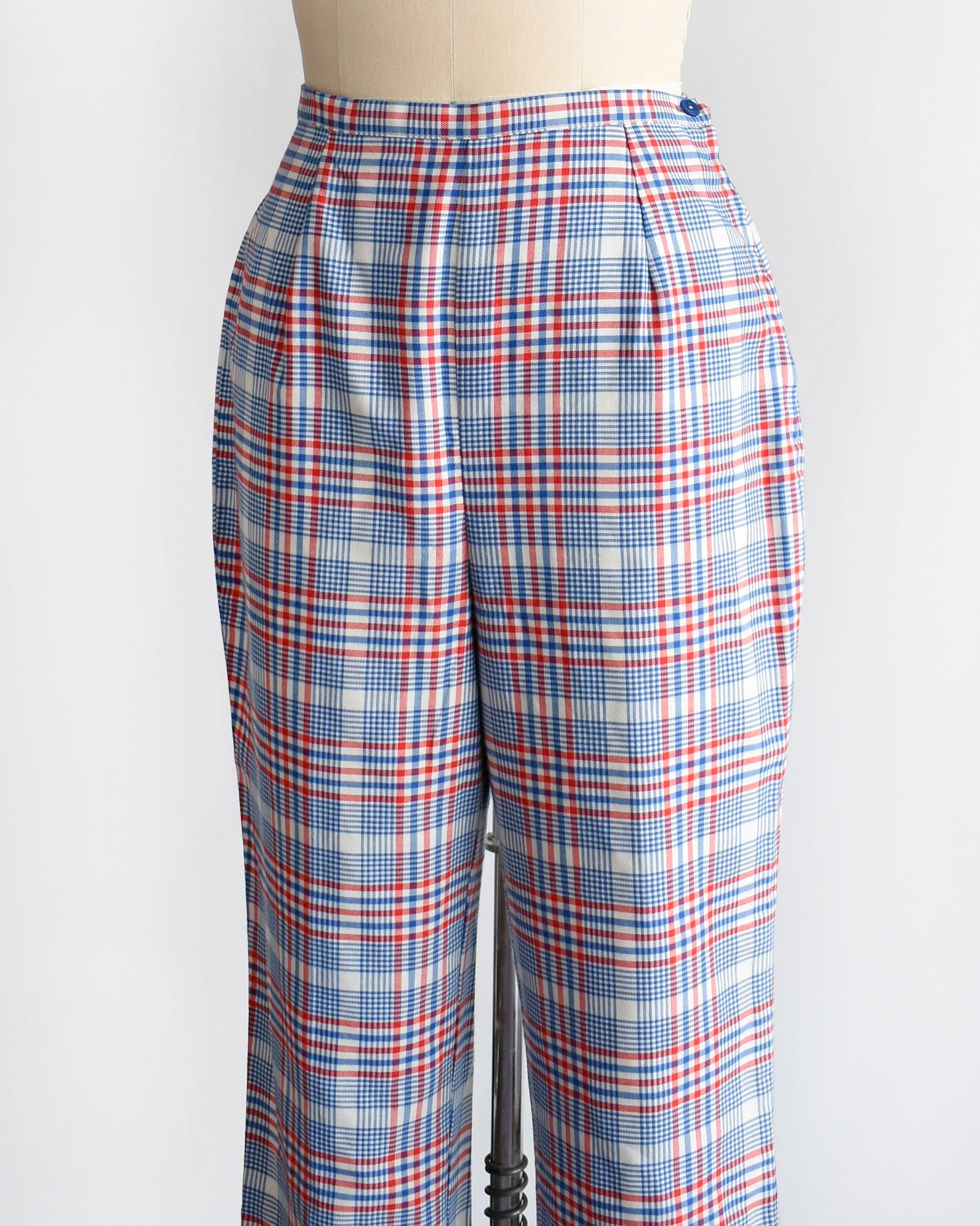 side front view of vintage 1970s red white and blue plaid pants on a dress form