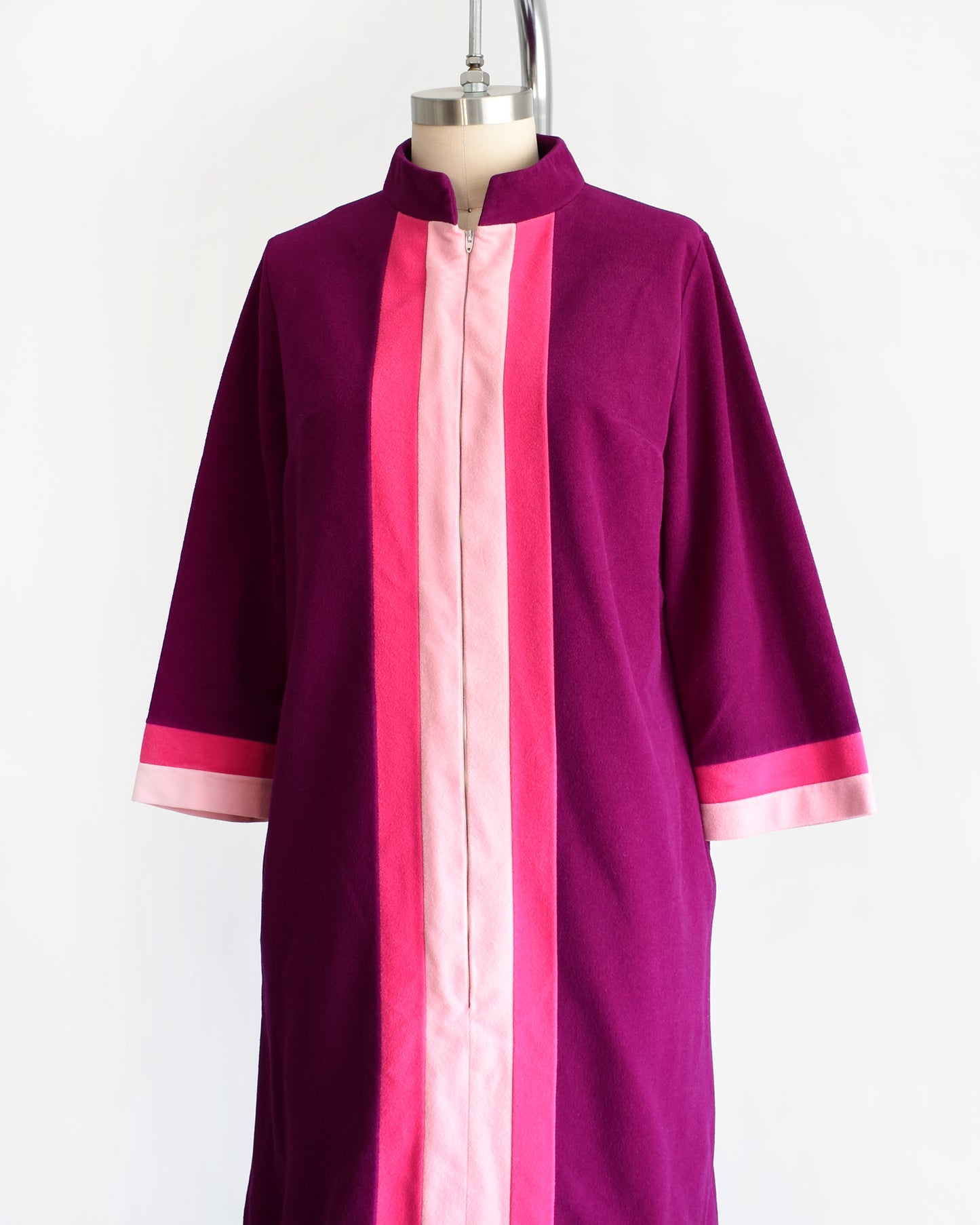 side front view of a vintage 1970s deep magenta and pink Vanity Fair robe on a mannequin against a white background