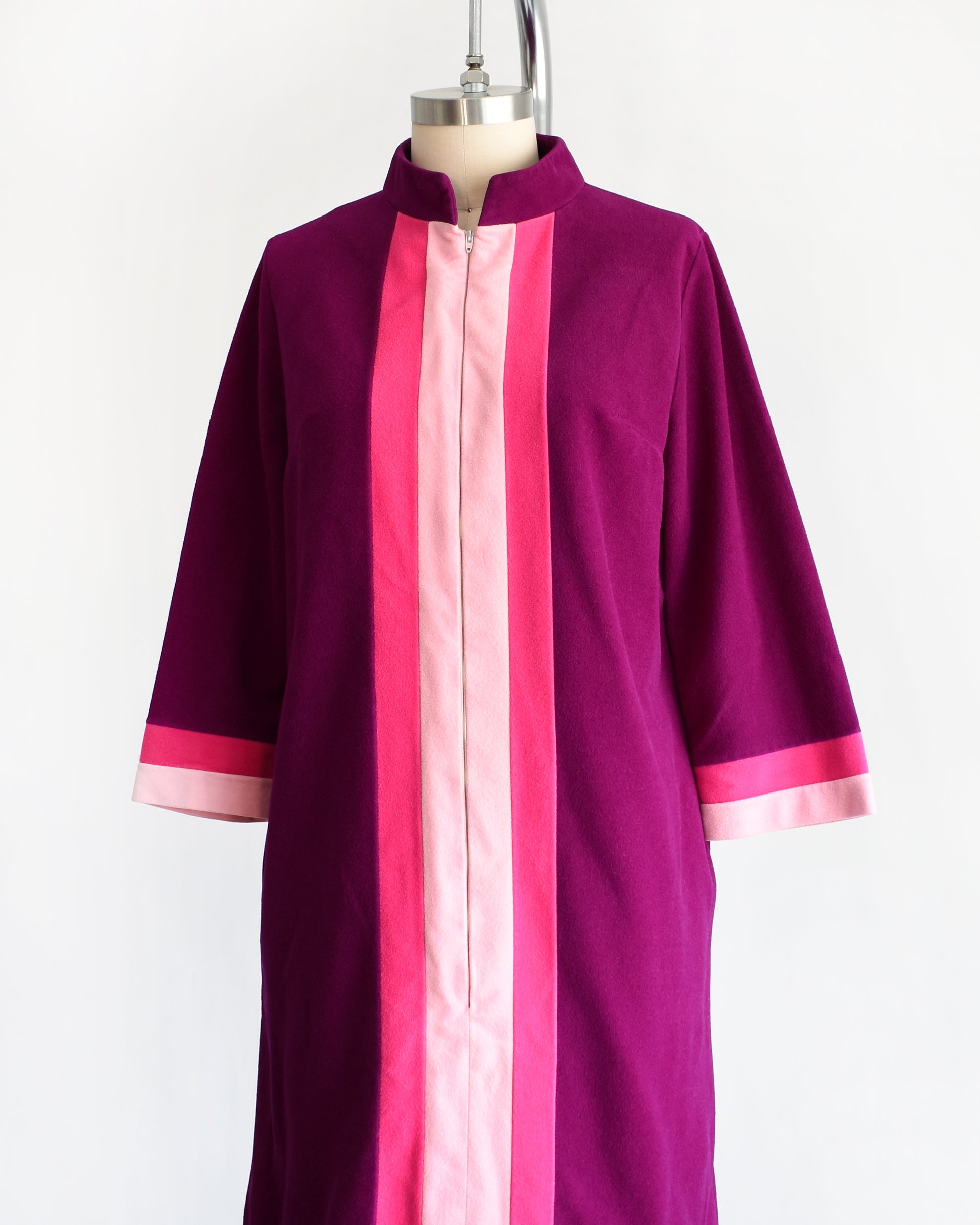 side front view of a vintage 1970s deep magenta and pink Vanity Fair robe on a mannequin against a white background