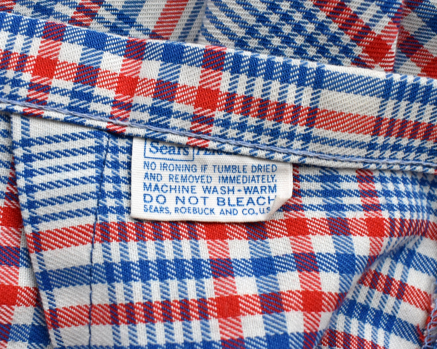 close up of the tag which says Sears and has care instructions underneath