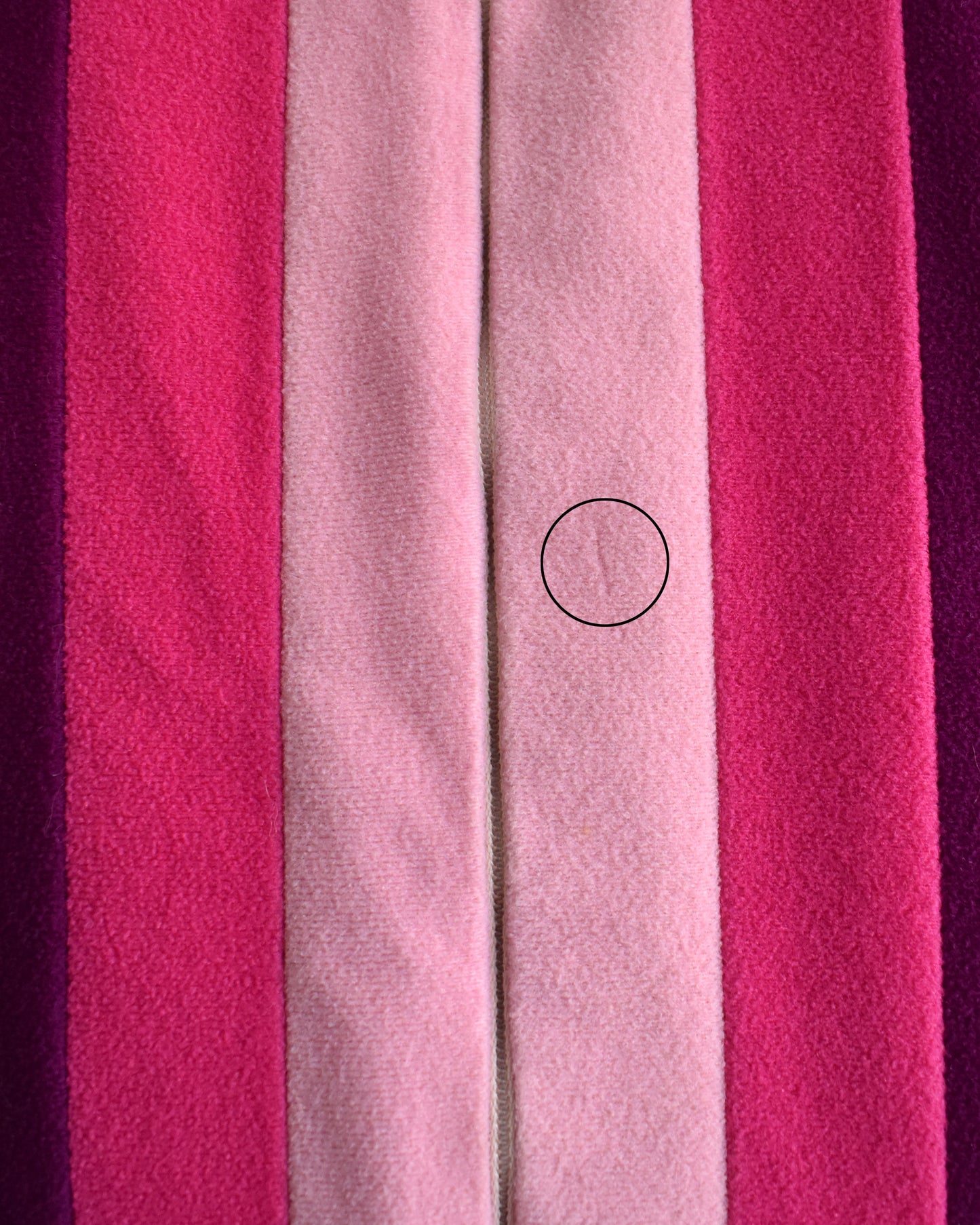 close up of the robe on the front that shows a little bit of fabric missing