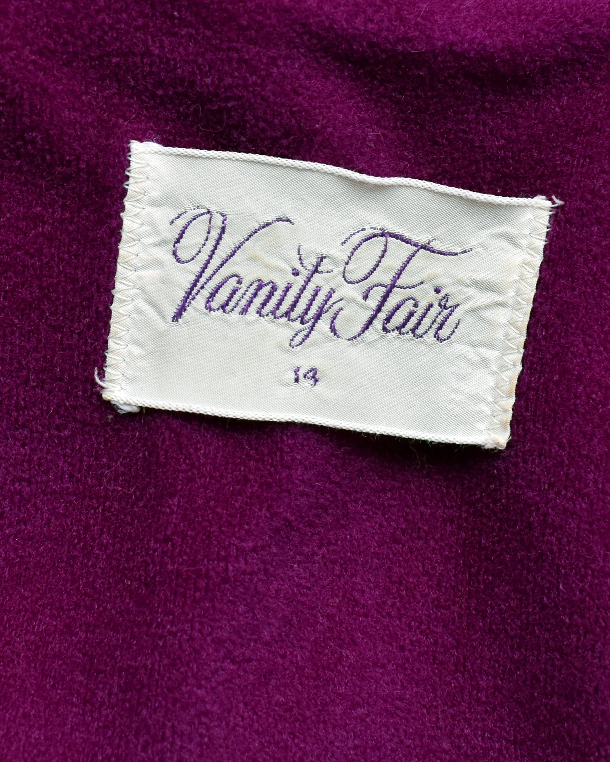 Vanity Fair label on a purple fabric background