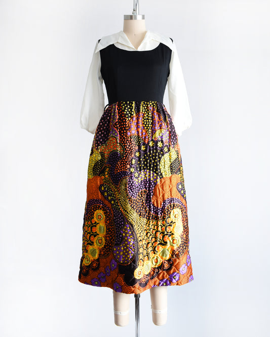 a vintage 1970s psychedelic quilted maxi dress on a mannequin against a white background