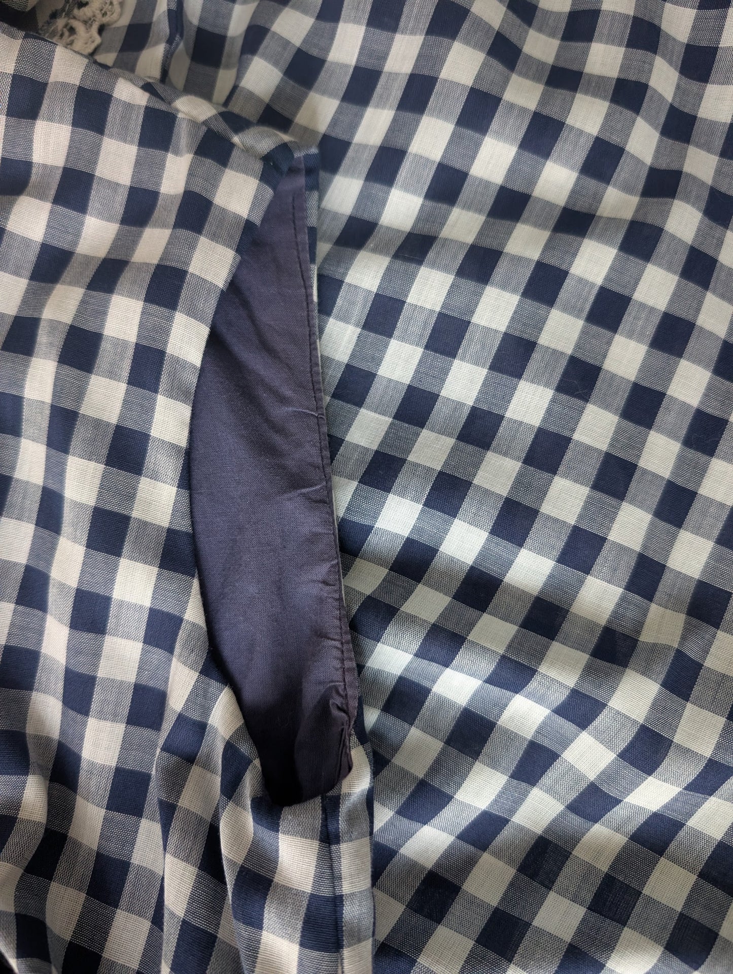 Close-up of the dark navy blue inner lining of the arm opening