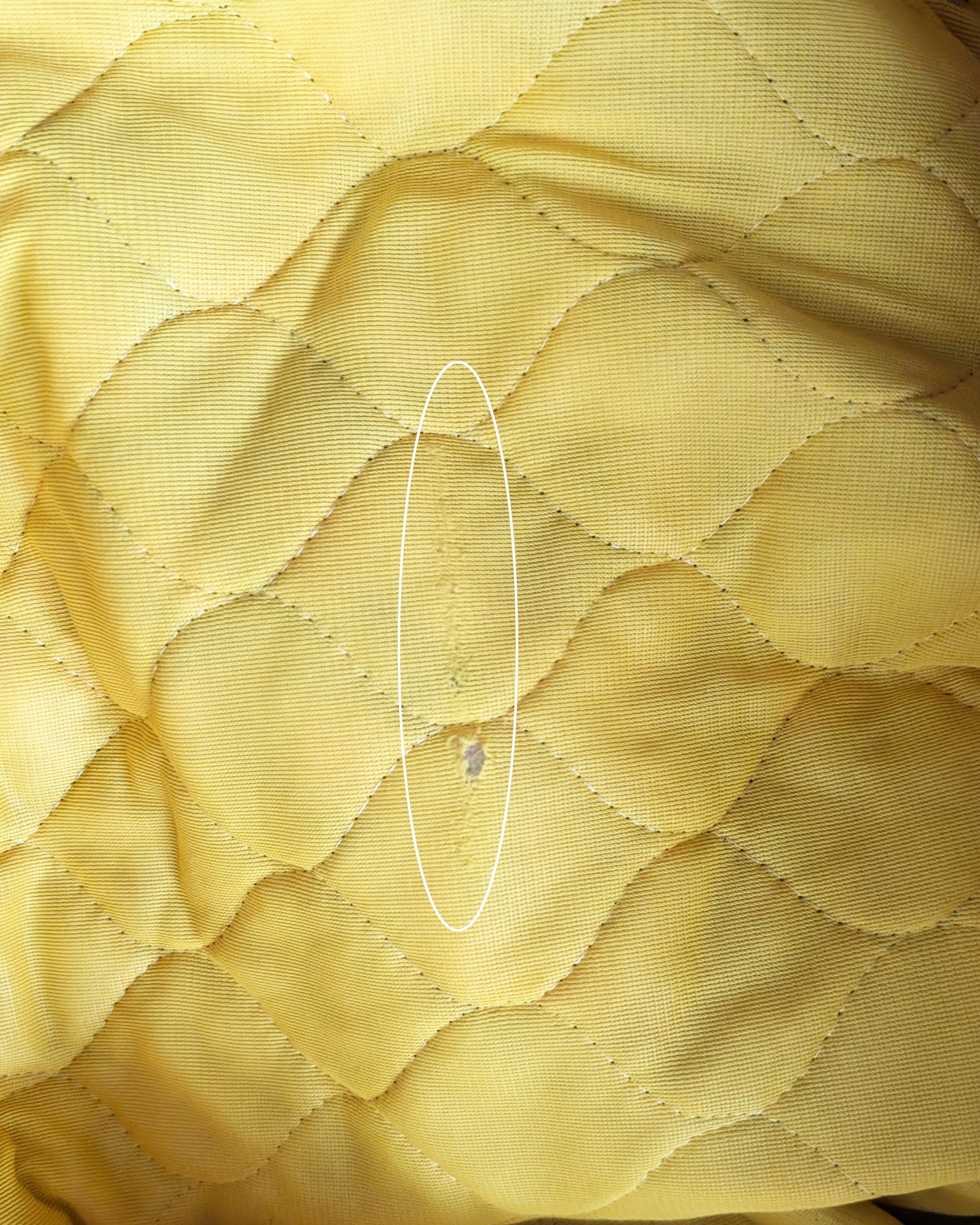 close up of a small hole and run on the inside of the skirt