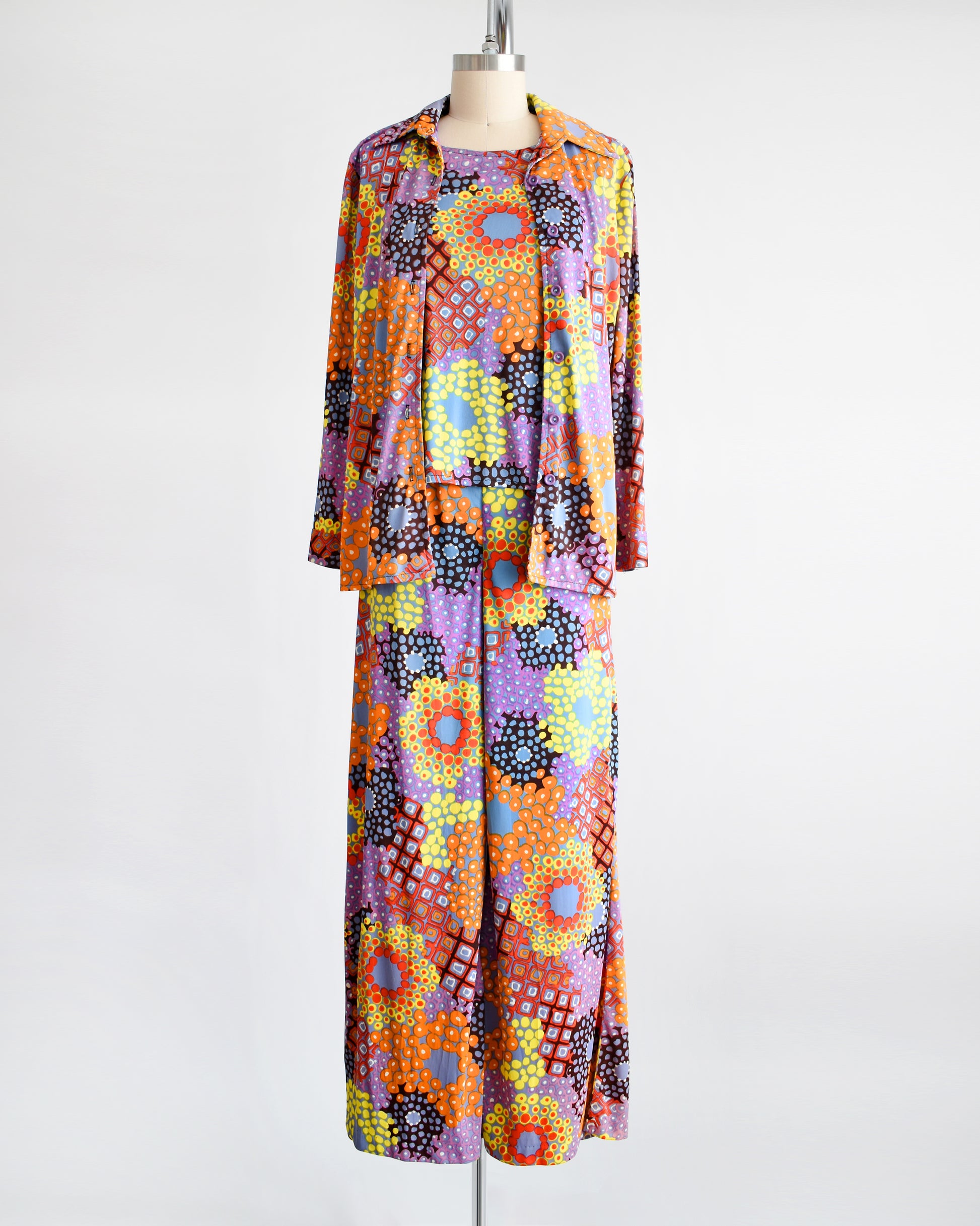 Vibrant vintage 1970 mod floral pantsuit three piece set.  The blouse is unbuttoned in this photo