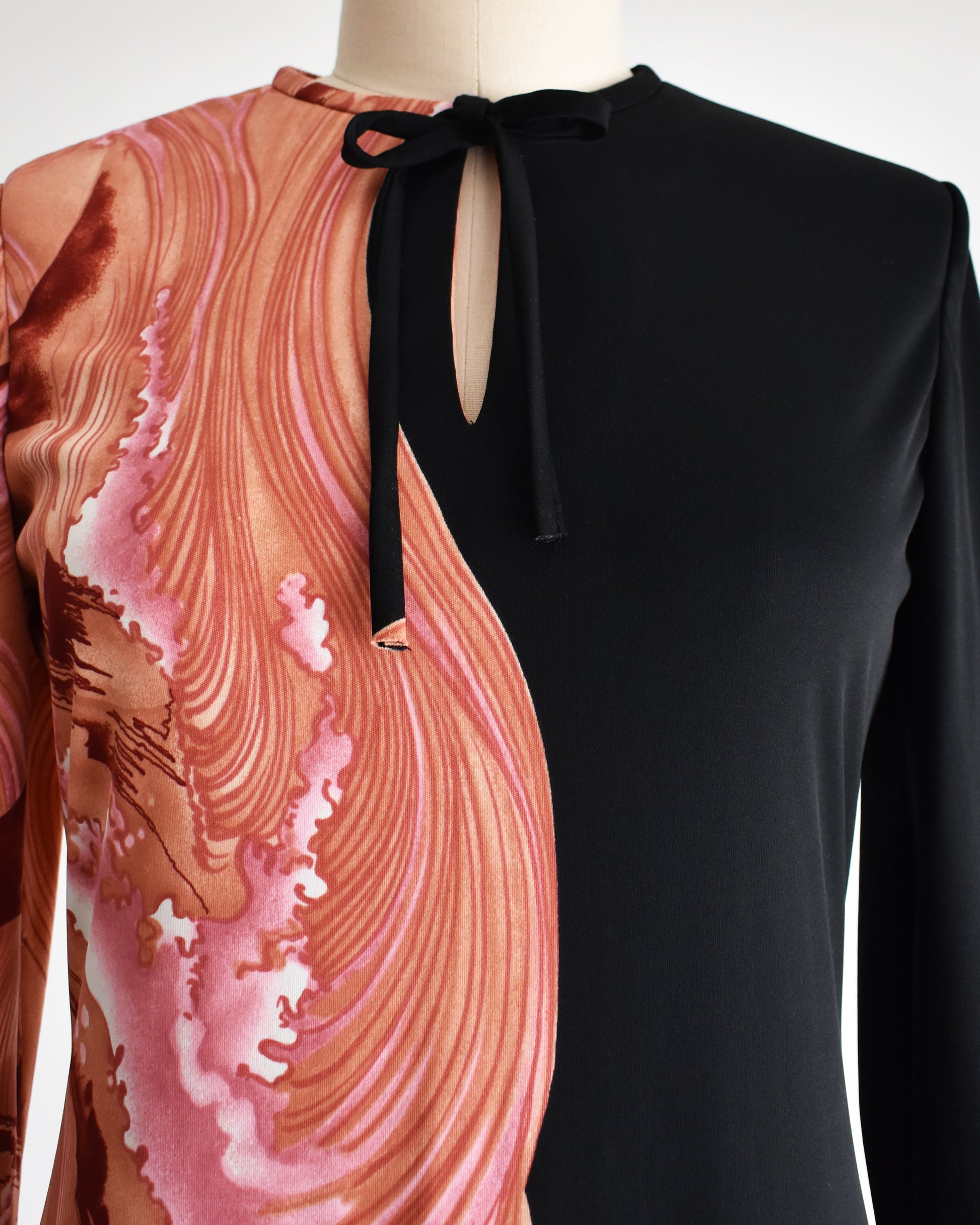 close up of the bodice of the dress showing the bowtie and keyhole neckline