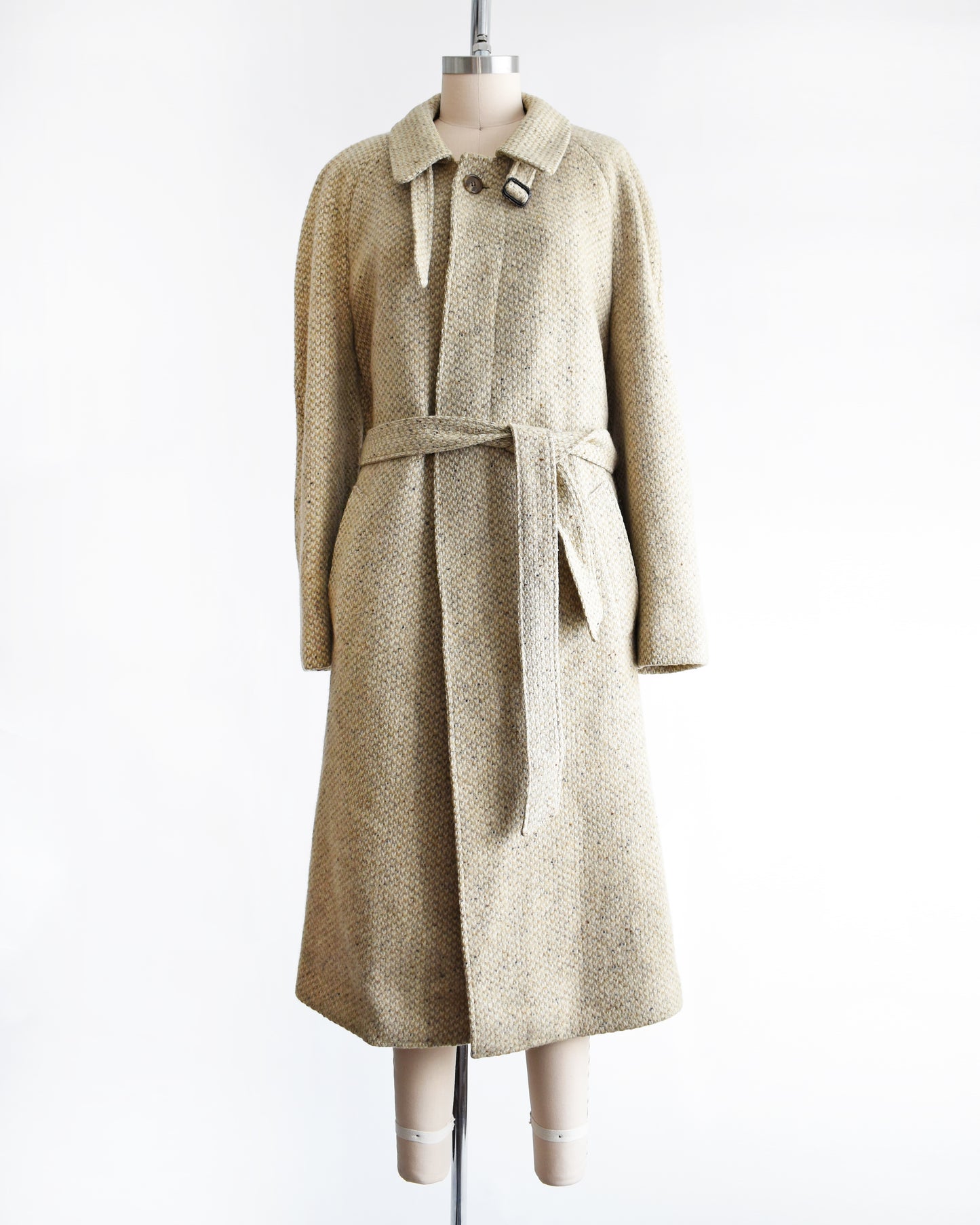 a vintage Pierre Cardin wool coat on a mannequin against a white background