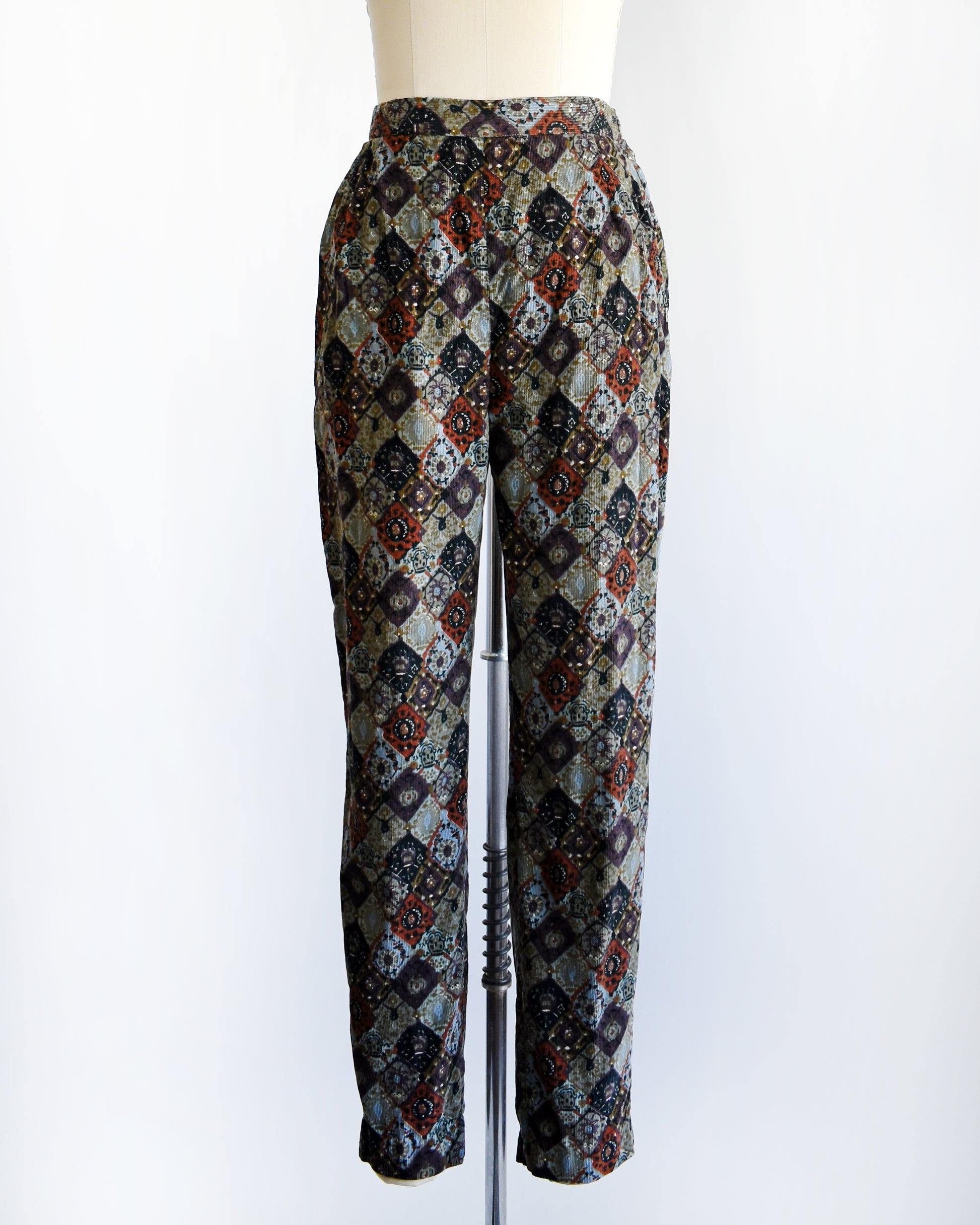 a vintage 1960s floral patterned pants on a mannequin against a white background