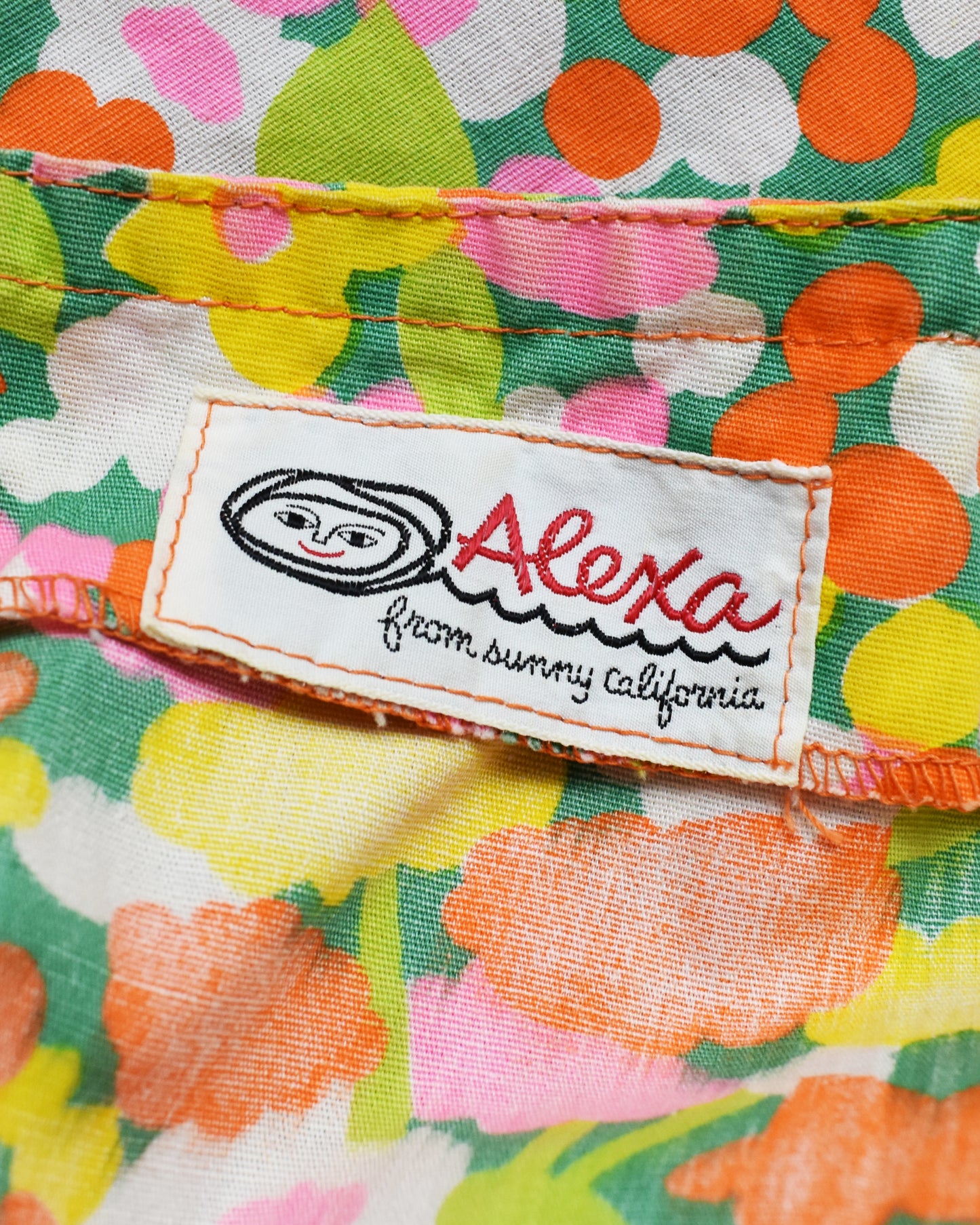 Close-up of the label reading 'Alexa from sunny California' featuring a stylized face logo.