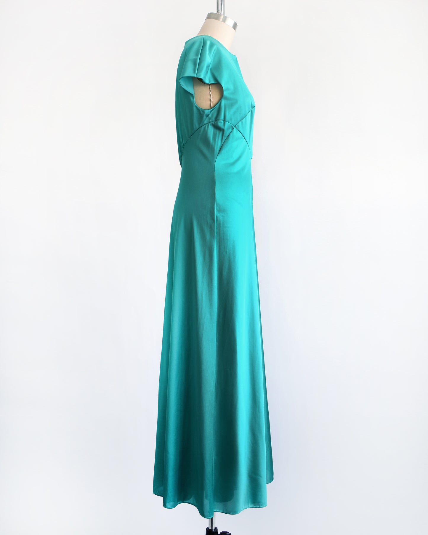 side view of a vintage 1970s teal palazzo jumpsuit by Vanity Fair