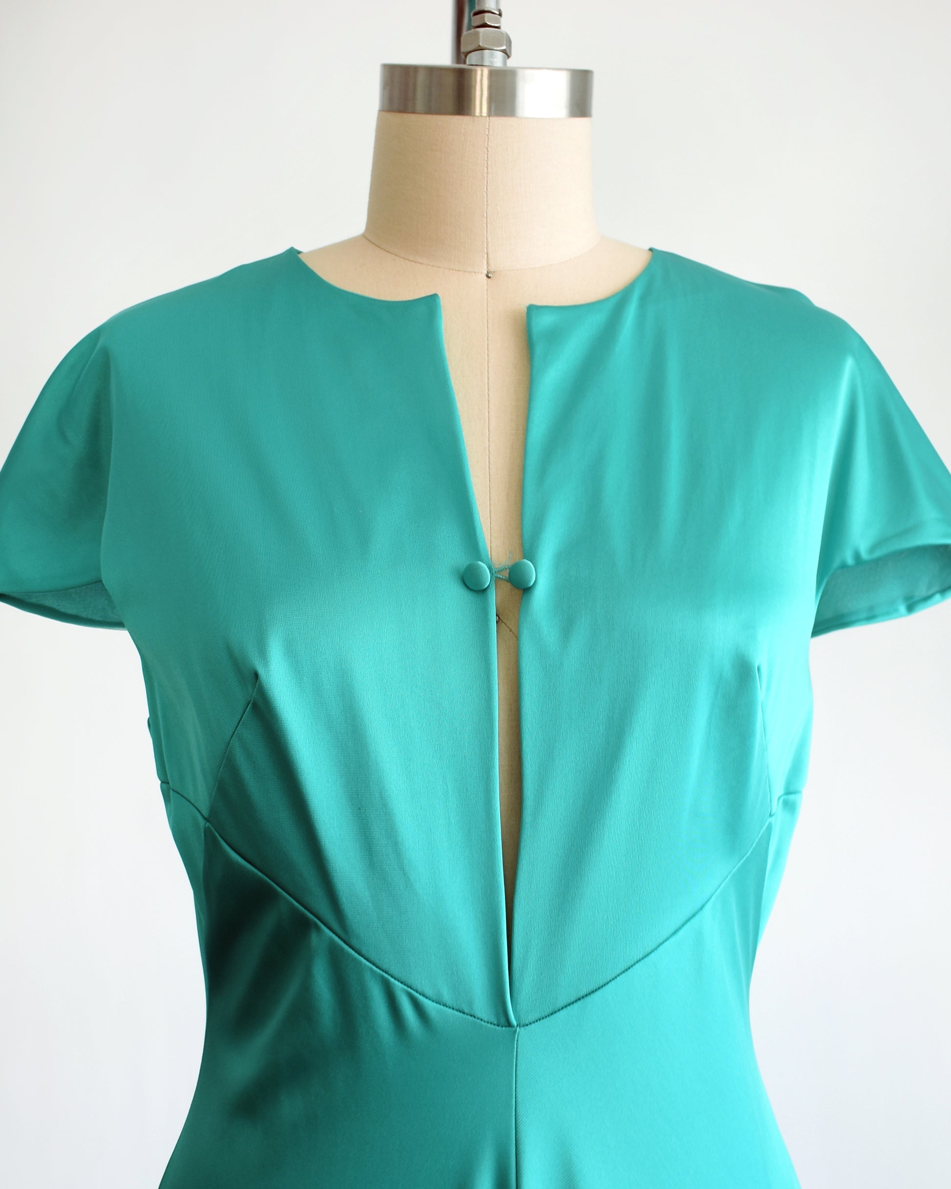 front view of a vintage 1970s teal palazzo jumpsuit by Vanity Fair