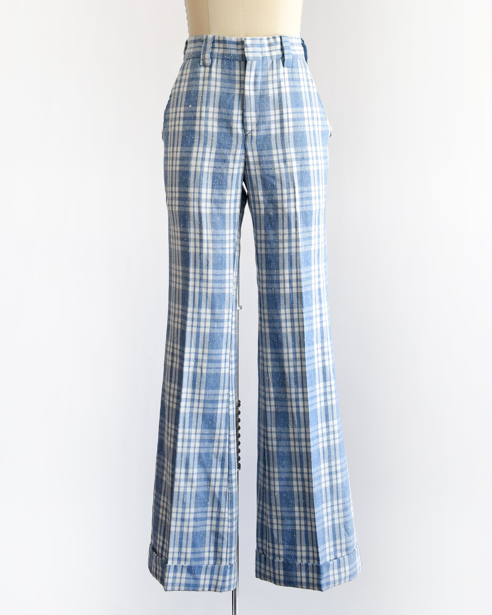 vintage 1970s blue and white plaid wide-leg pants displayed on a cream dress form mannequin against a plain white background.
