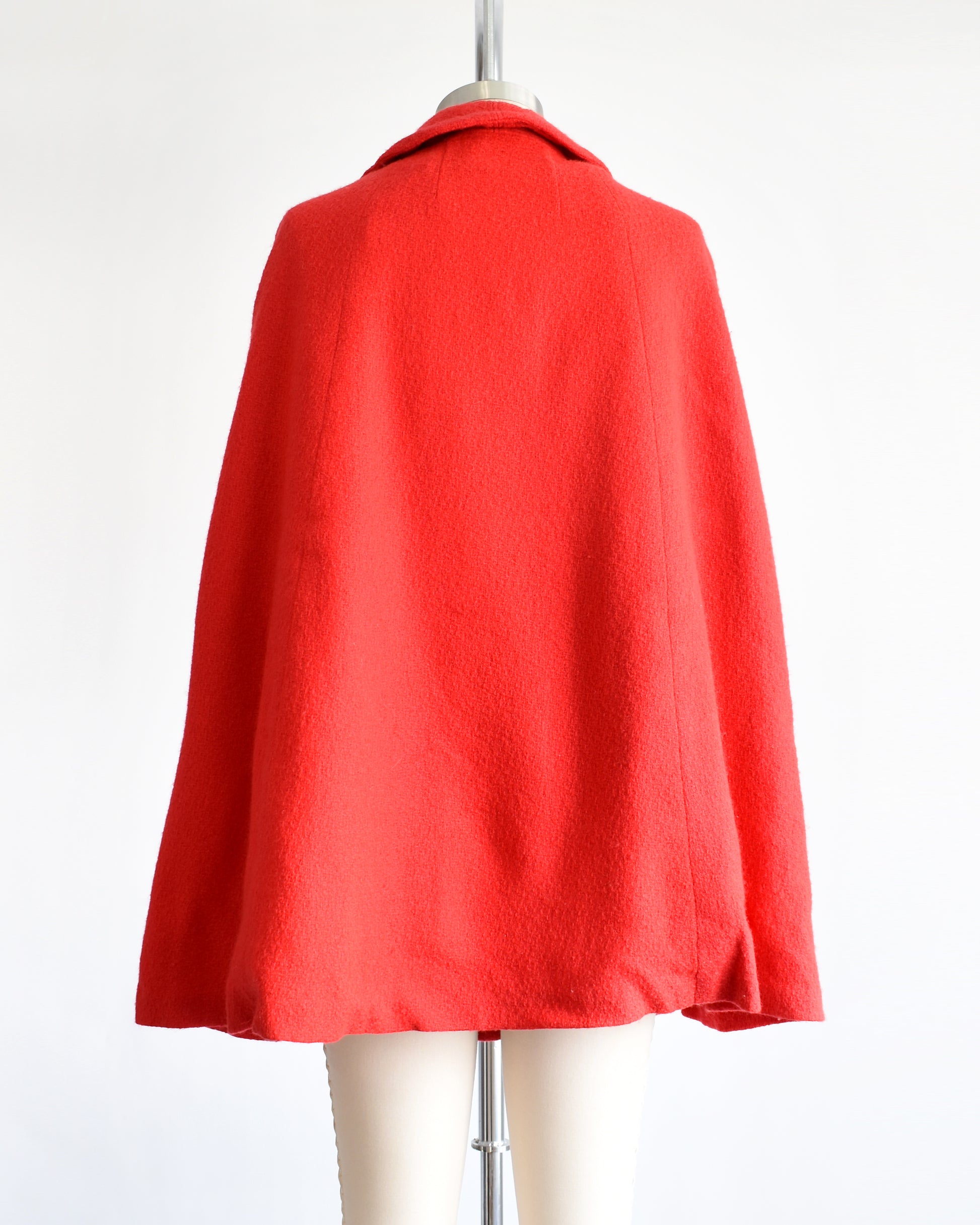 back view of a vintage 1960s red cape